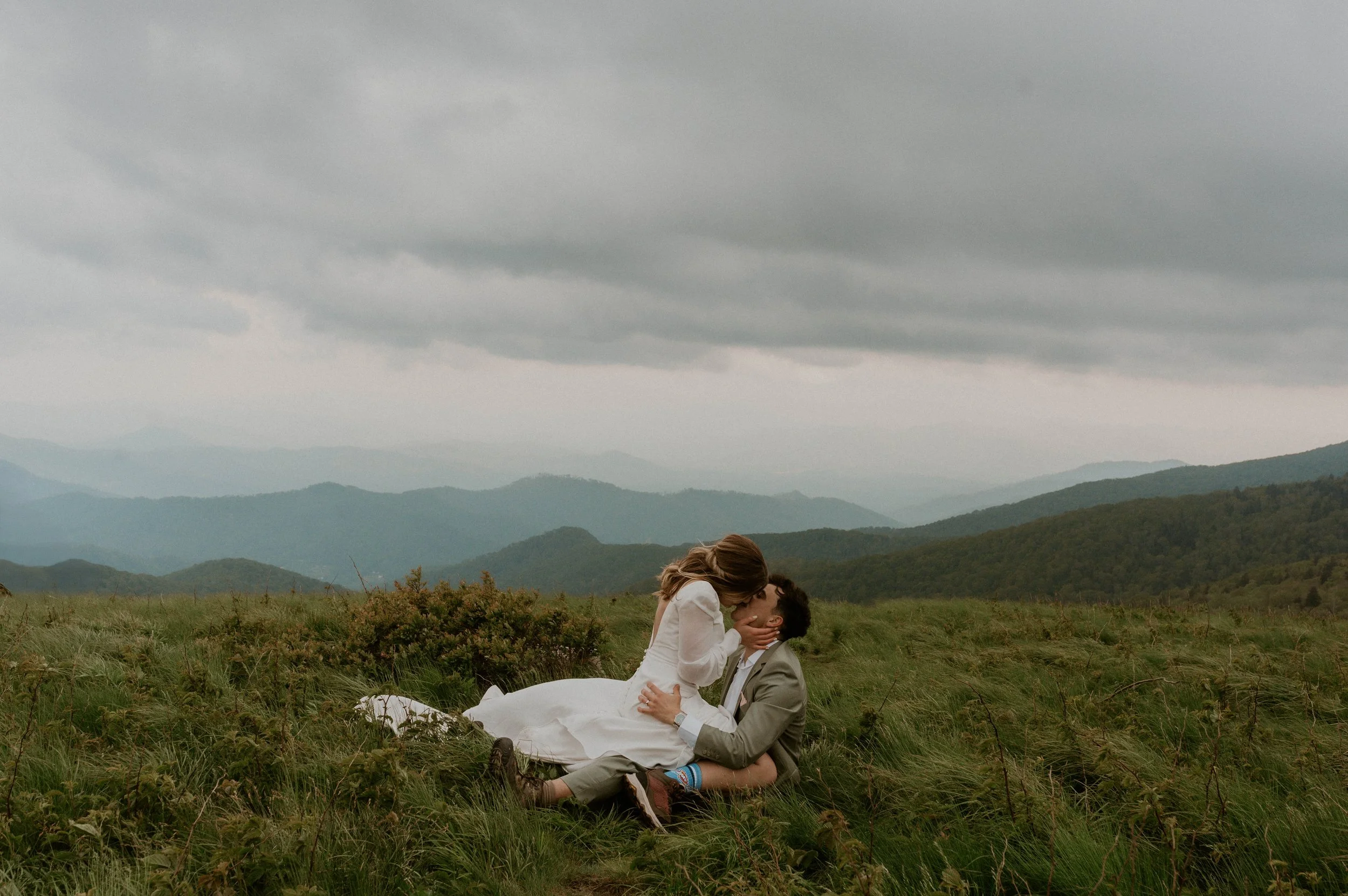 Couple embracing in the fog during intimate Roan Mountain Elopement