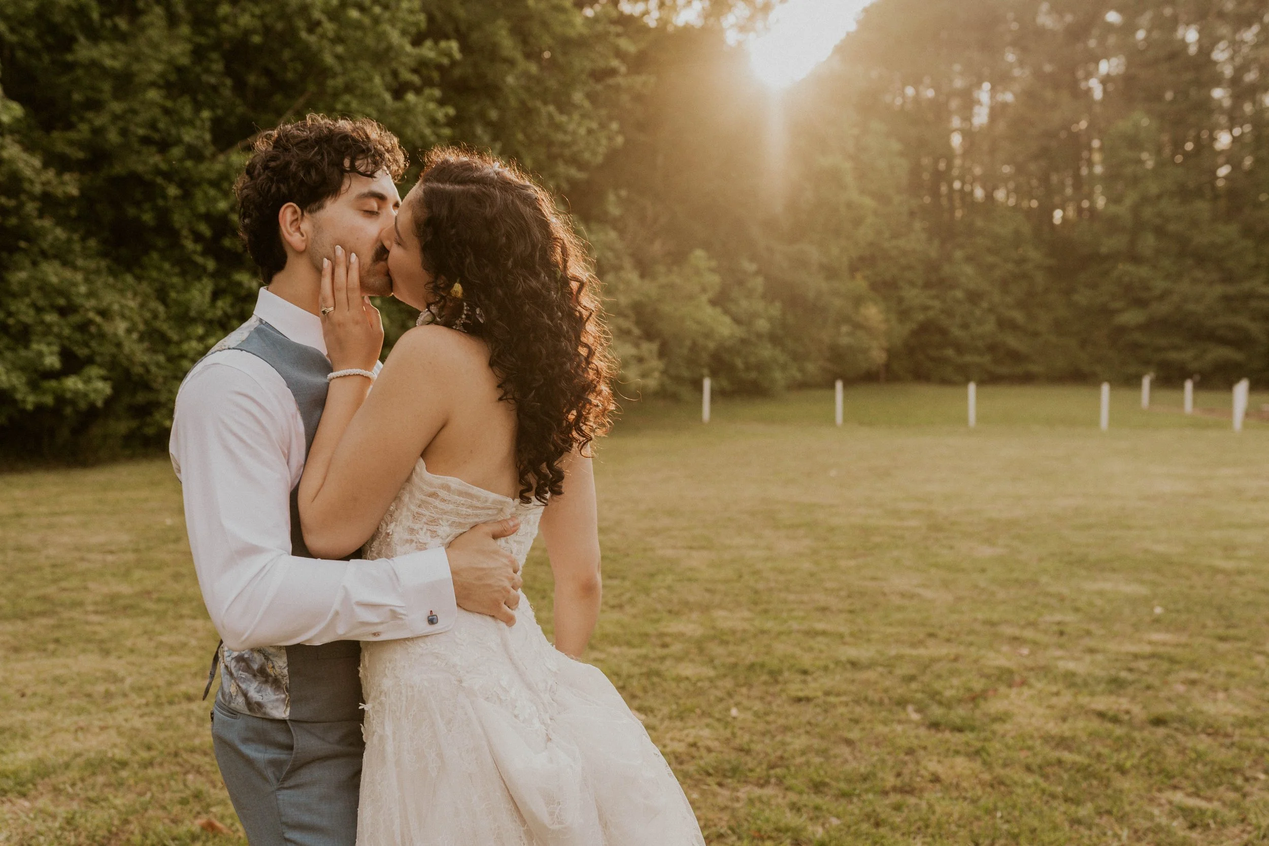 Madison and Benji celebrating together during their Oxford Oaks Farms wedding