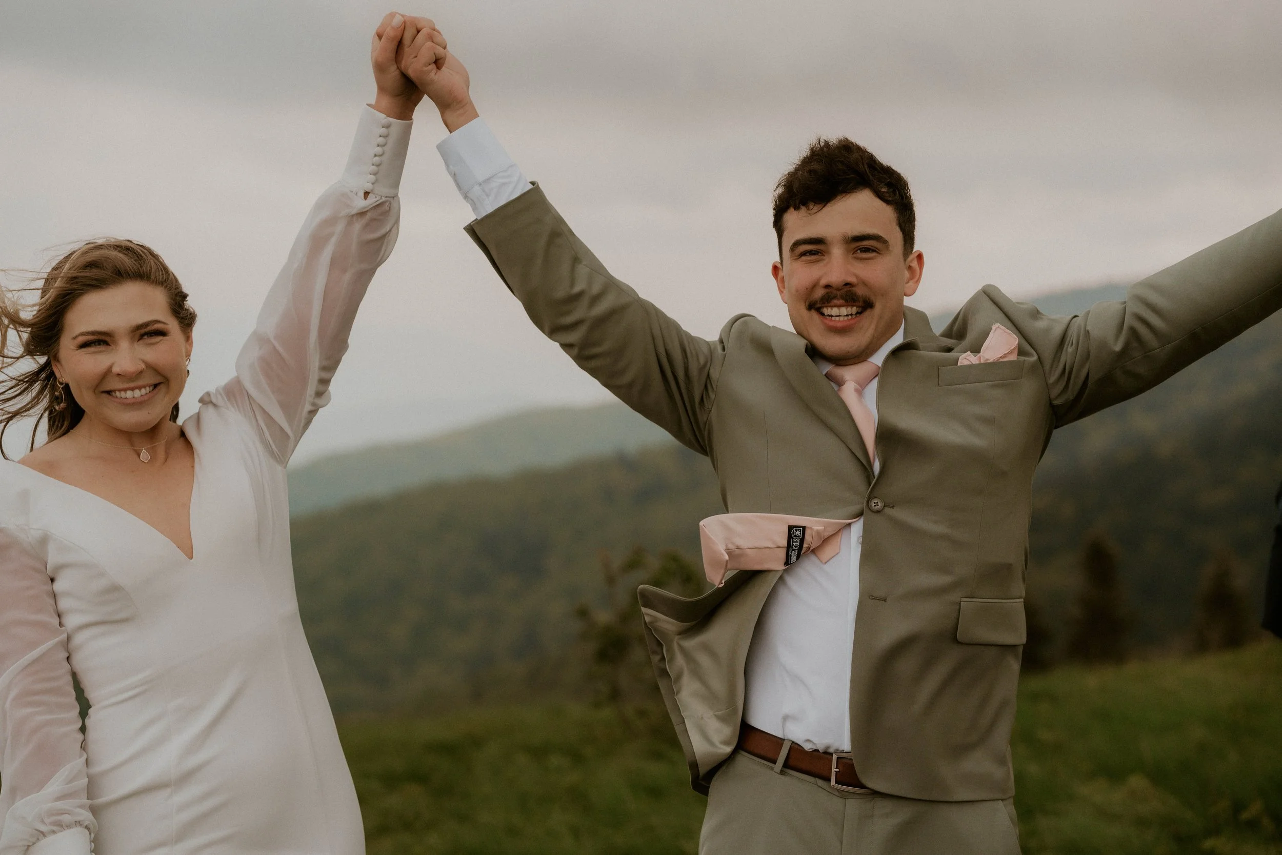 Couple embracing in the fog during intimate Roan Mountain elopement