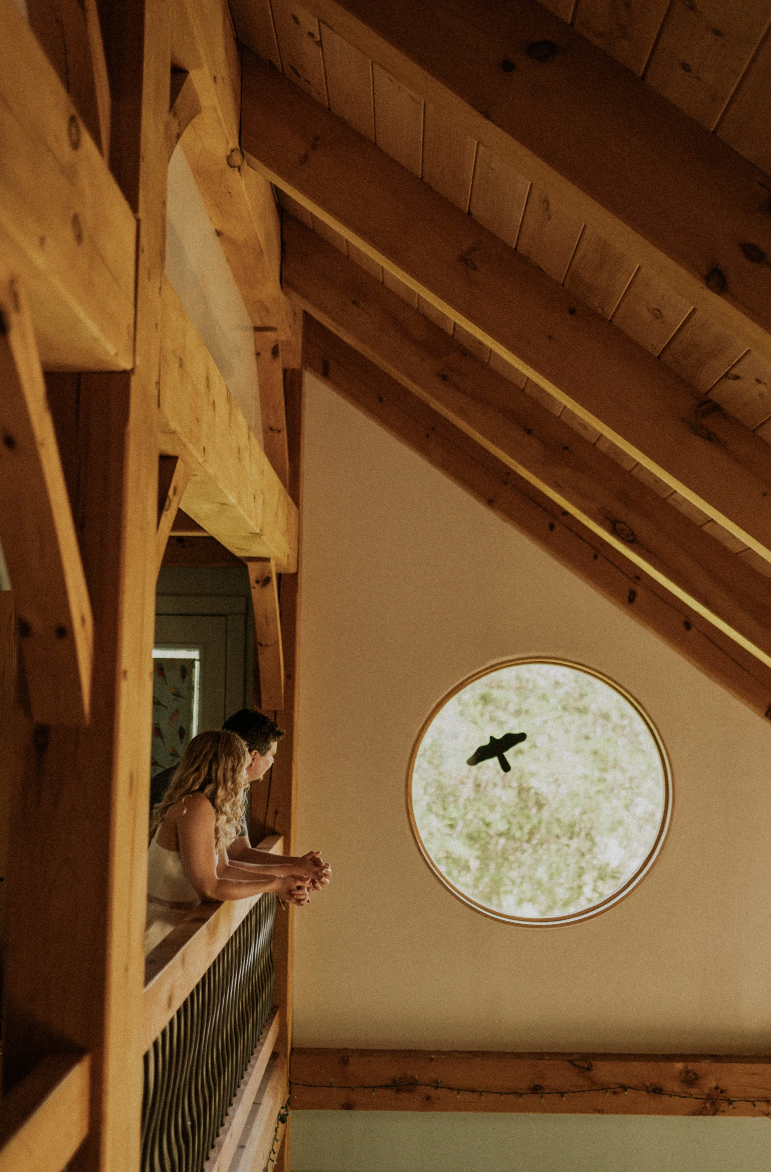 Documentary elopement photography of a couple getting ready at home before a family land wedding