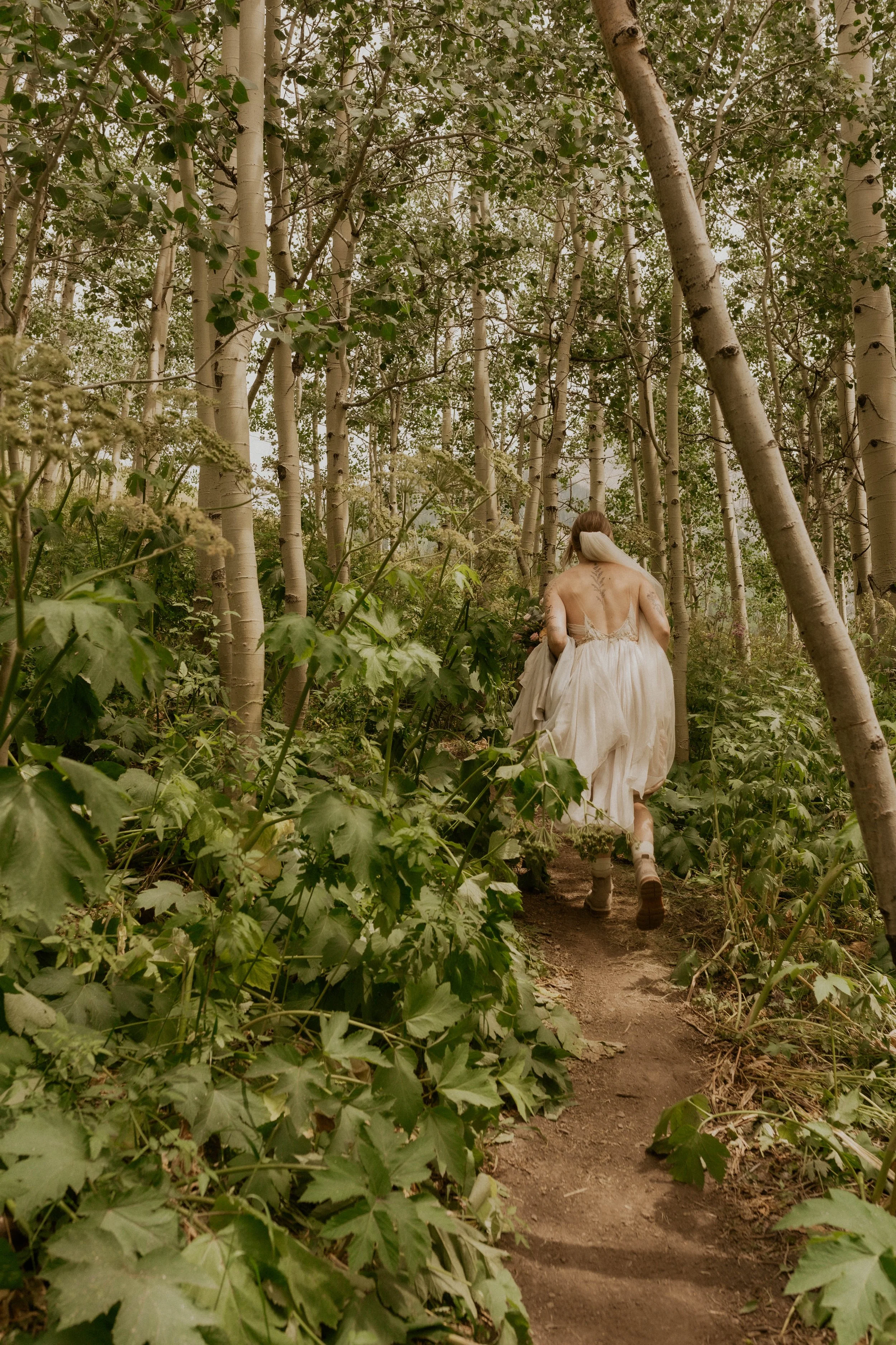 Couple hiking to their first look during a Crested Butte mountain elopement