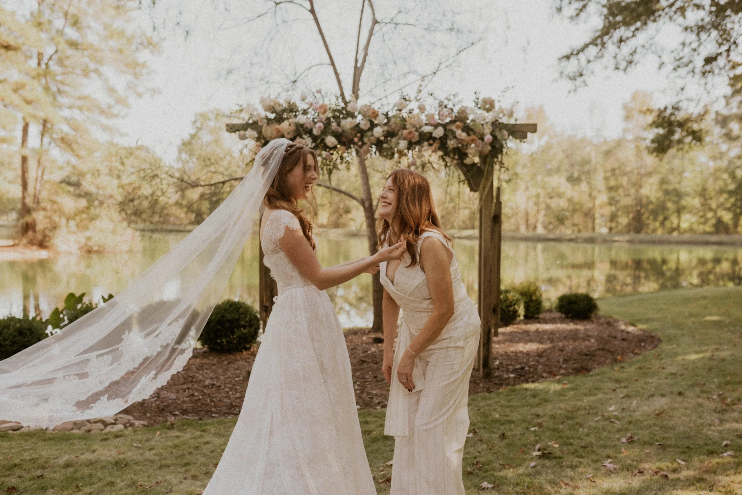 Bride getting ready with bridesmaids outdoors at The Little Herb House in Raleigh, NC
