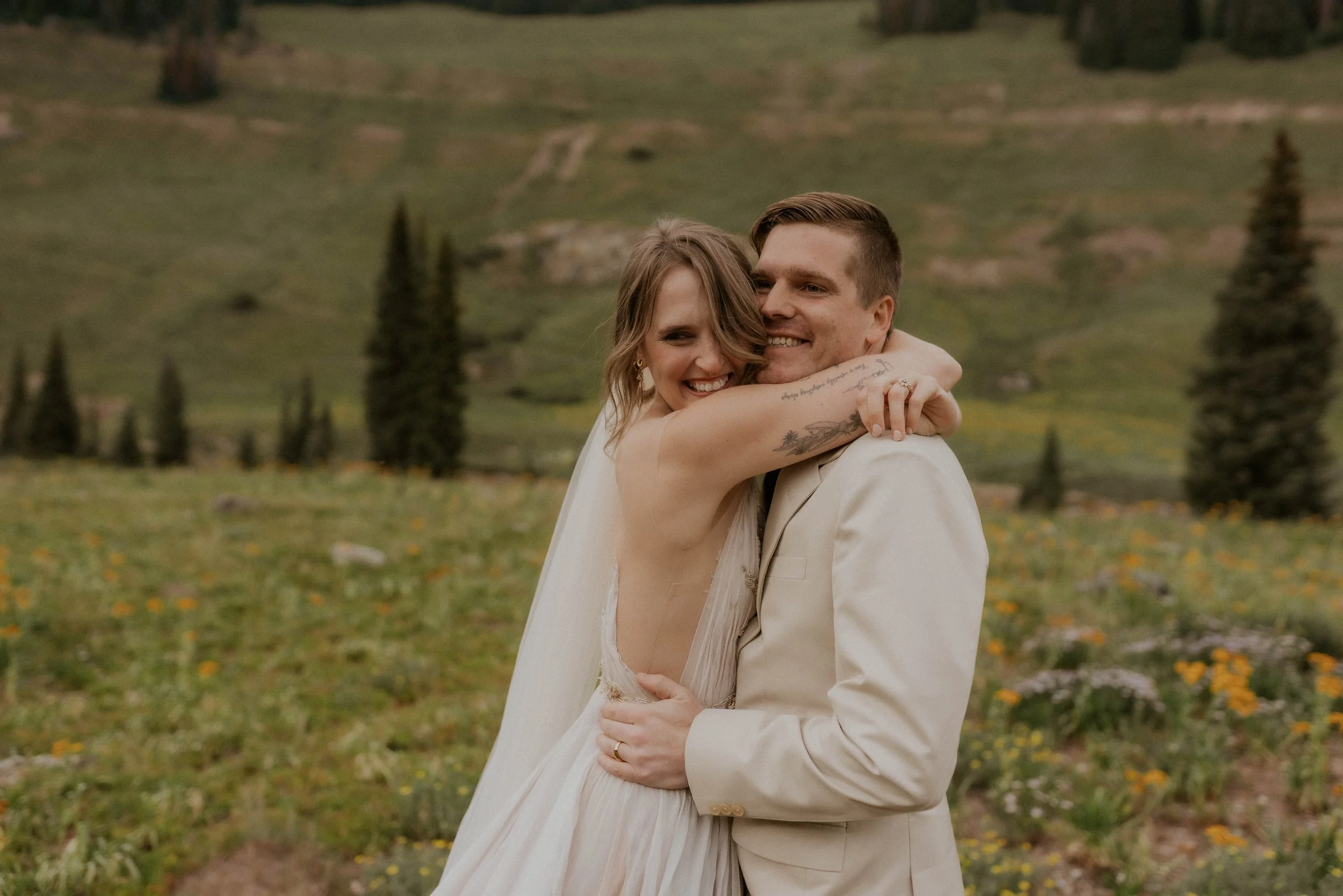 Intimate elopement ceremony surrounded by wildflowers in Colorado