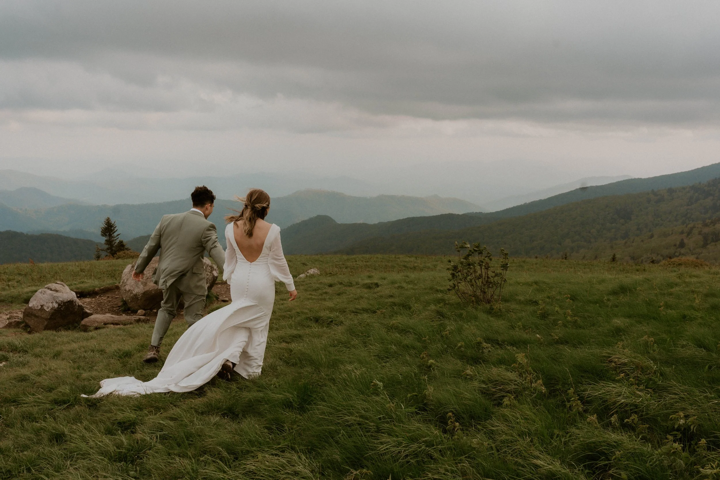 Couple embracing in the fog during intimate Roan Mountain elopement
