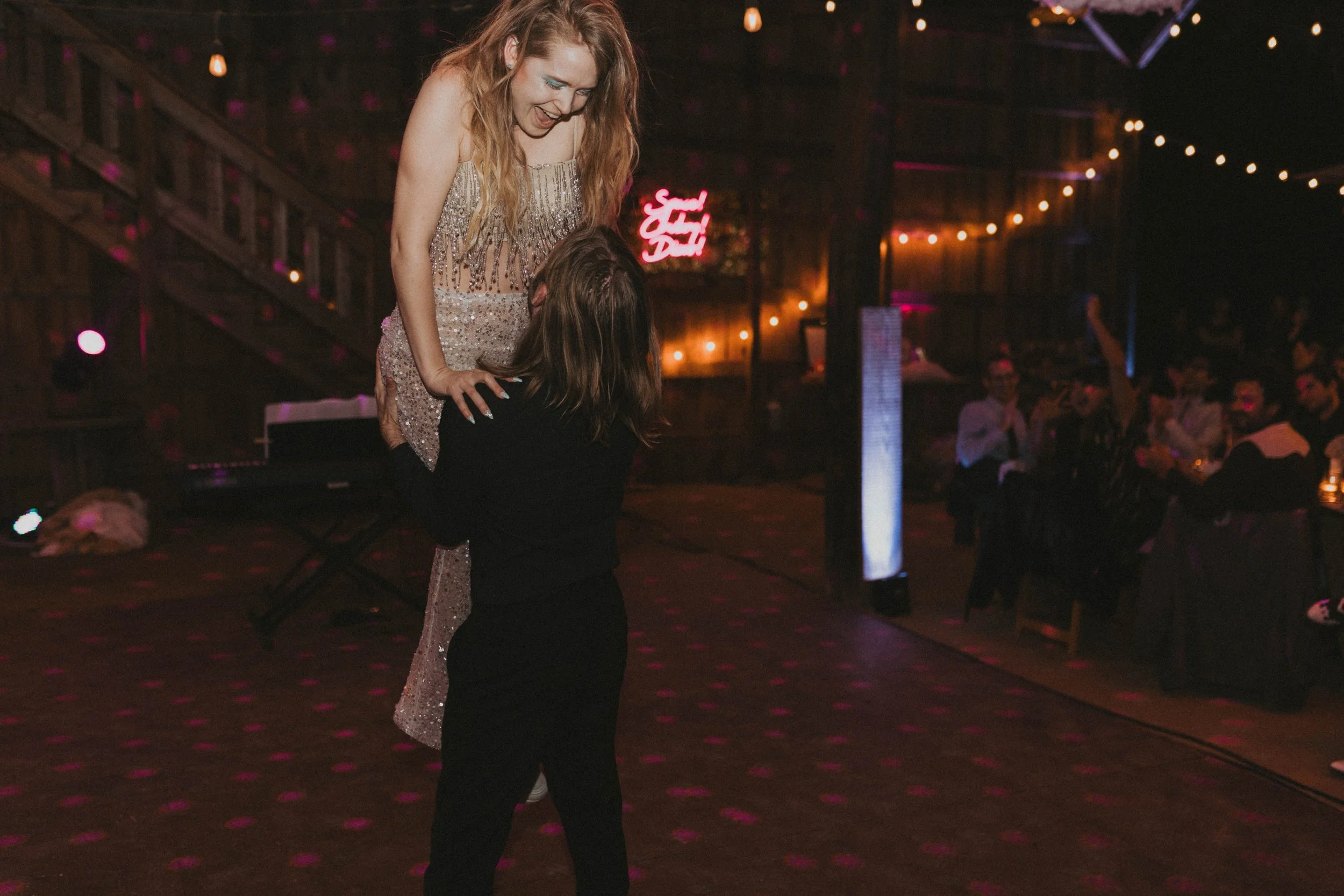 Friends and family dancing at Sol and Ian's Space Cowboy Disco wedding reception