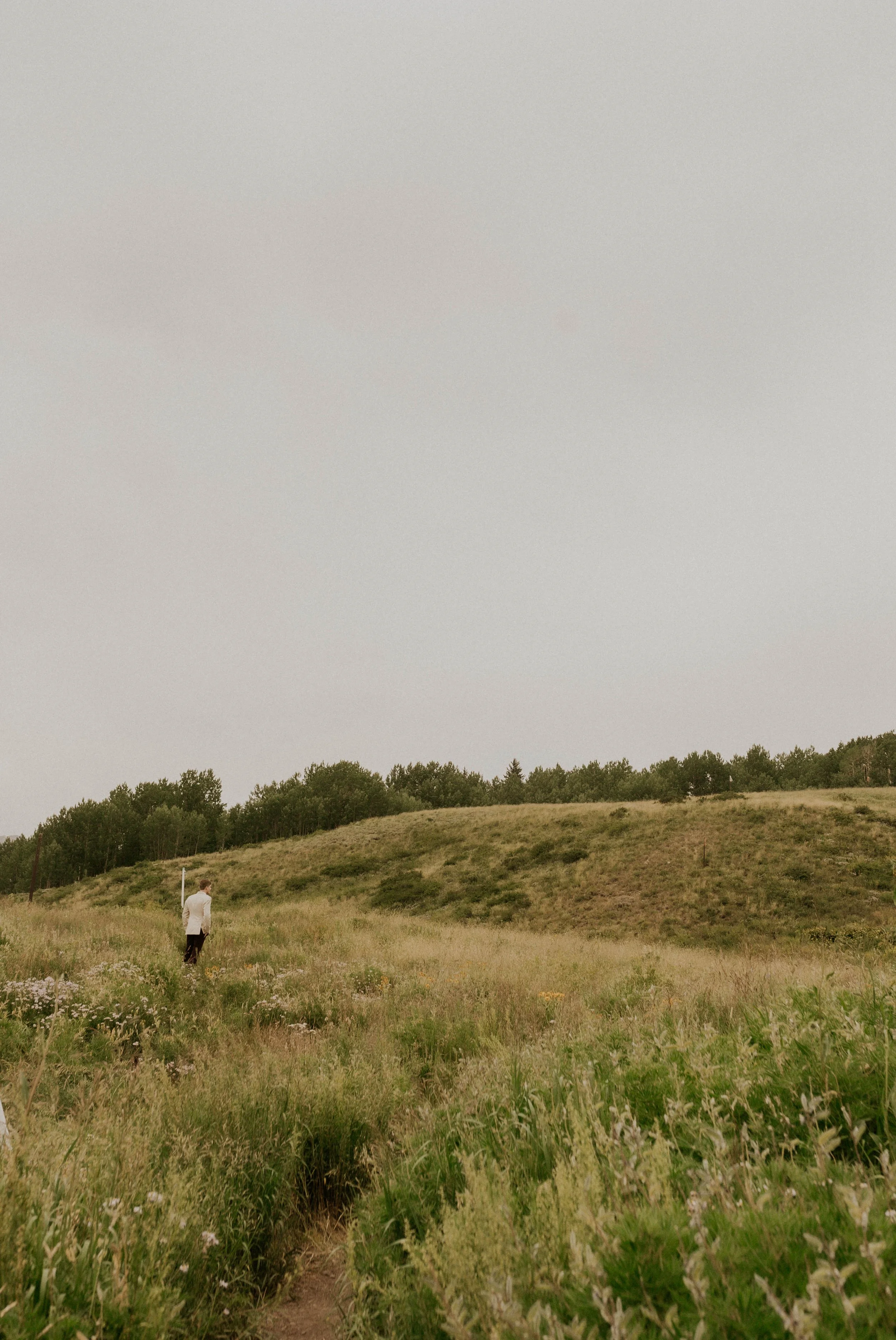 Couple hiking to their first look during a Crested Butte mountain elopement