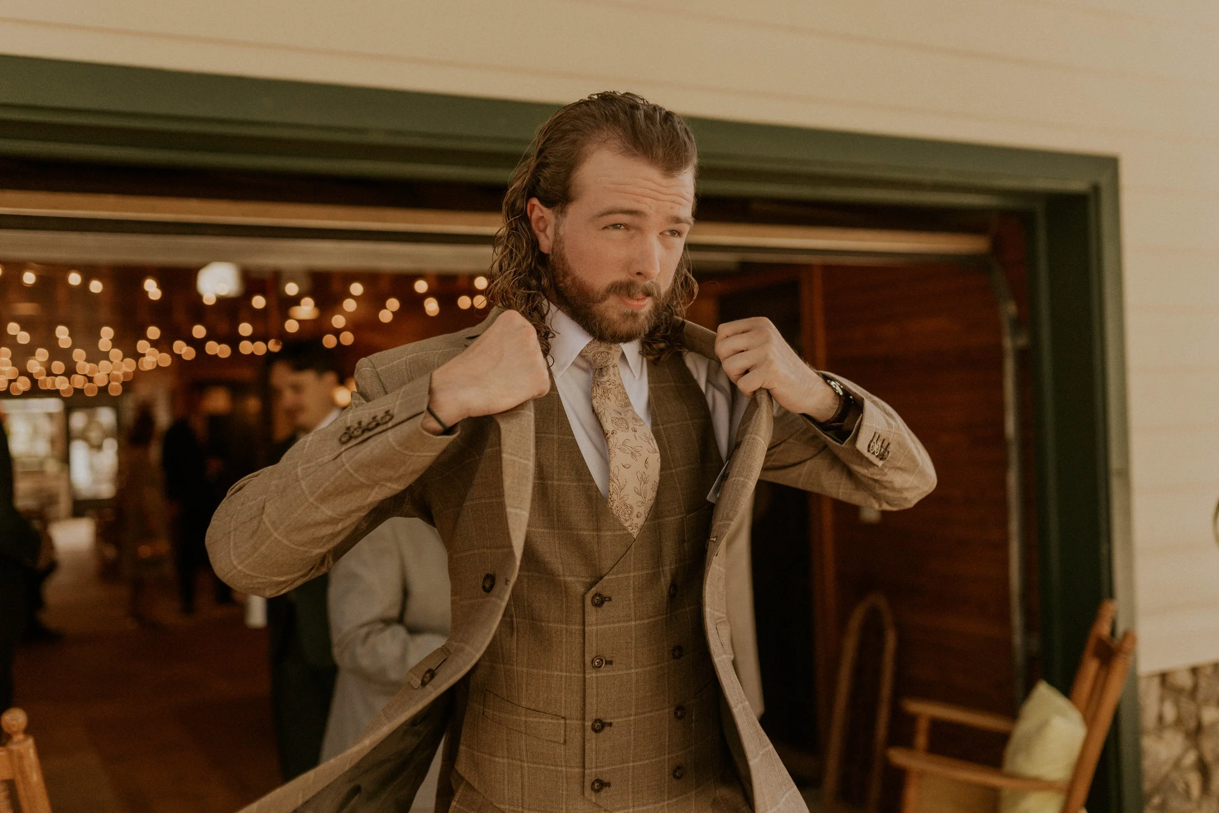 Groom getting ready with groomsmen at The Little Herb House in Raleigh, NC