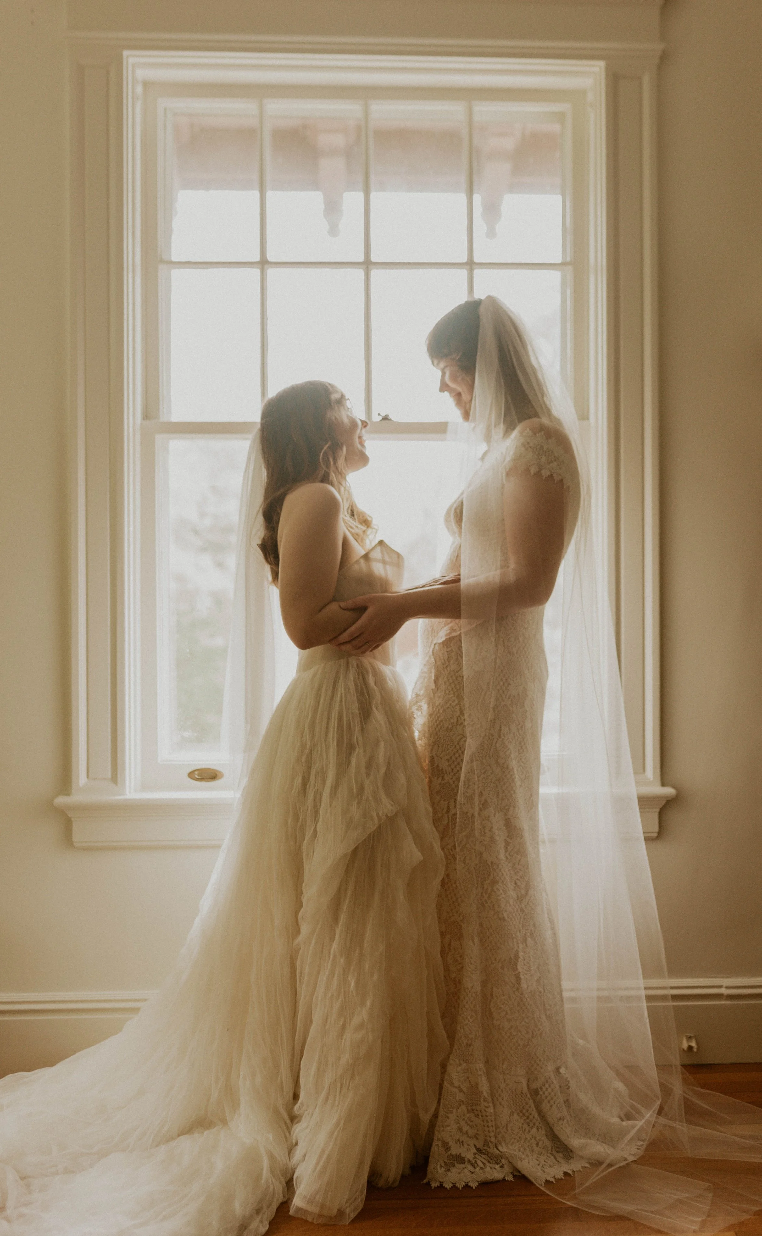 Brides sharing an intimate moment before durham wedding