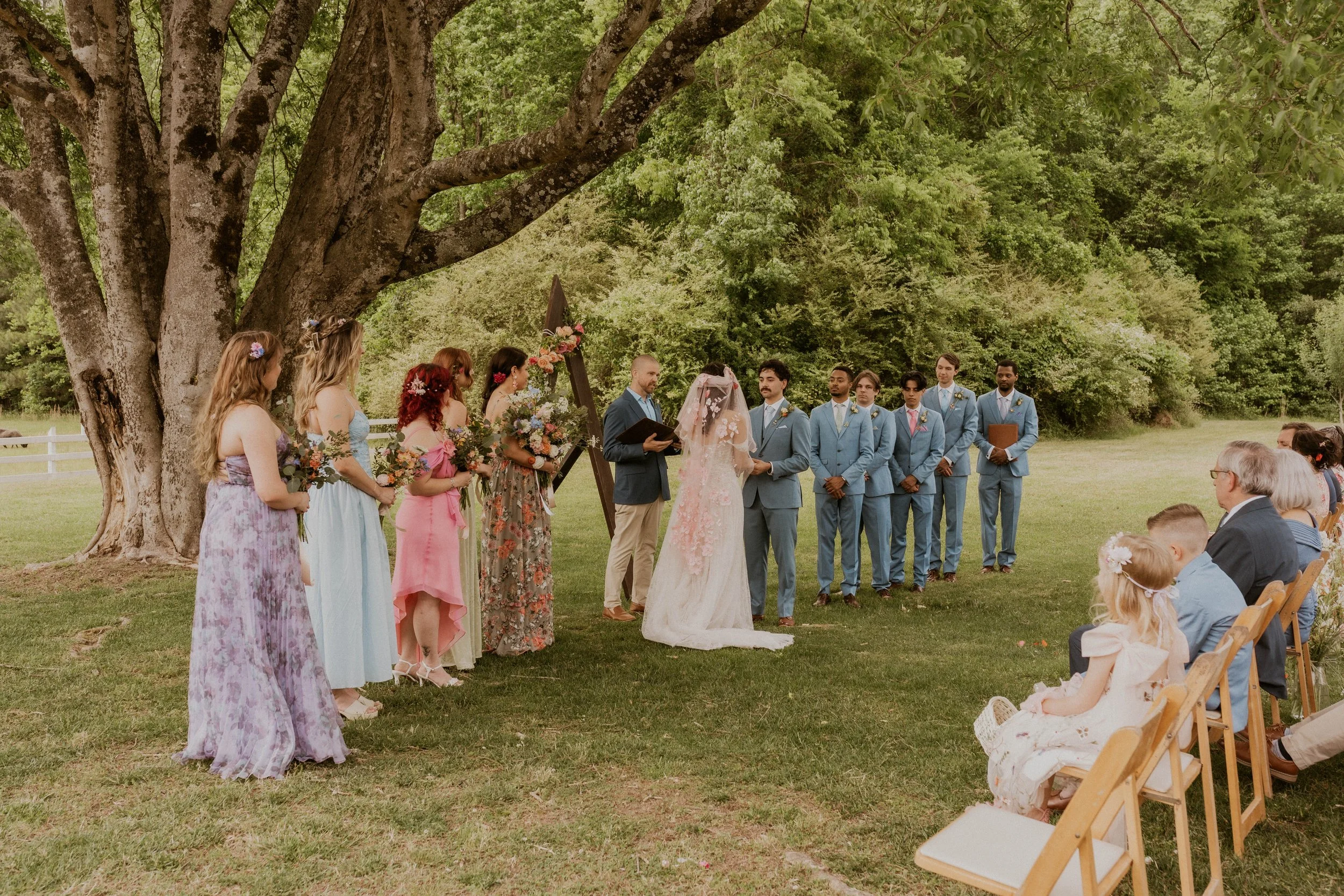 Madison wearing a colorful floral veil on her wedding day