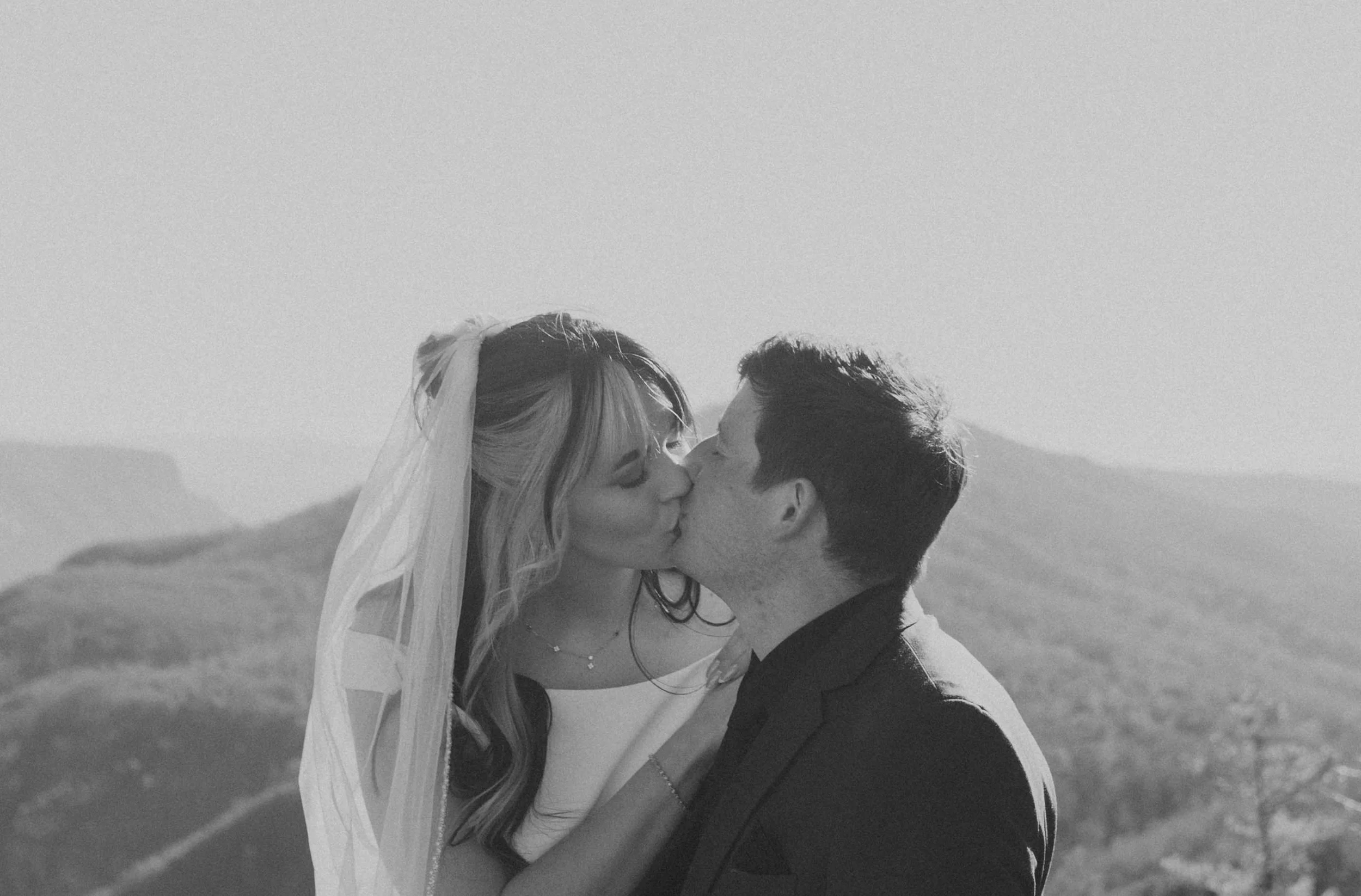 Couple embracing with sweeping mountain views during Asheville elopement