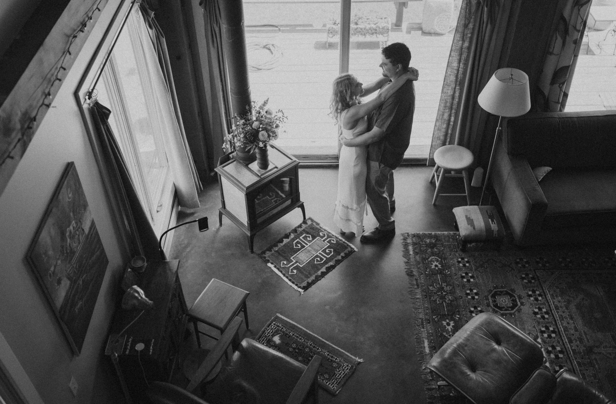 Intimate elopement getting ready inside a family-built home, natural light and quiet morning moments
