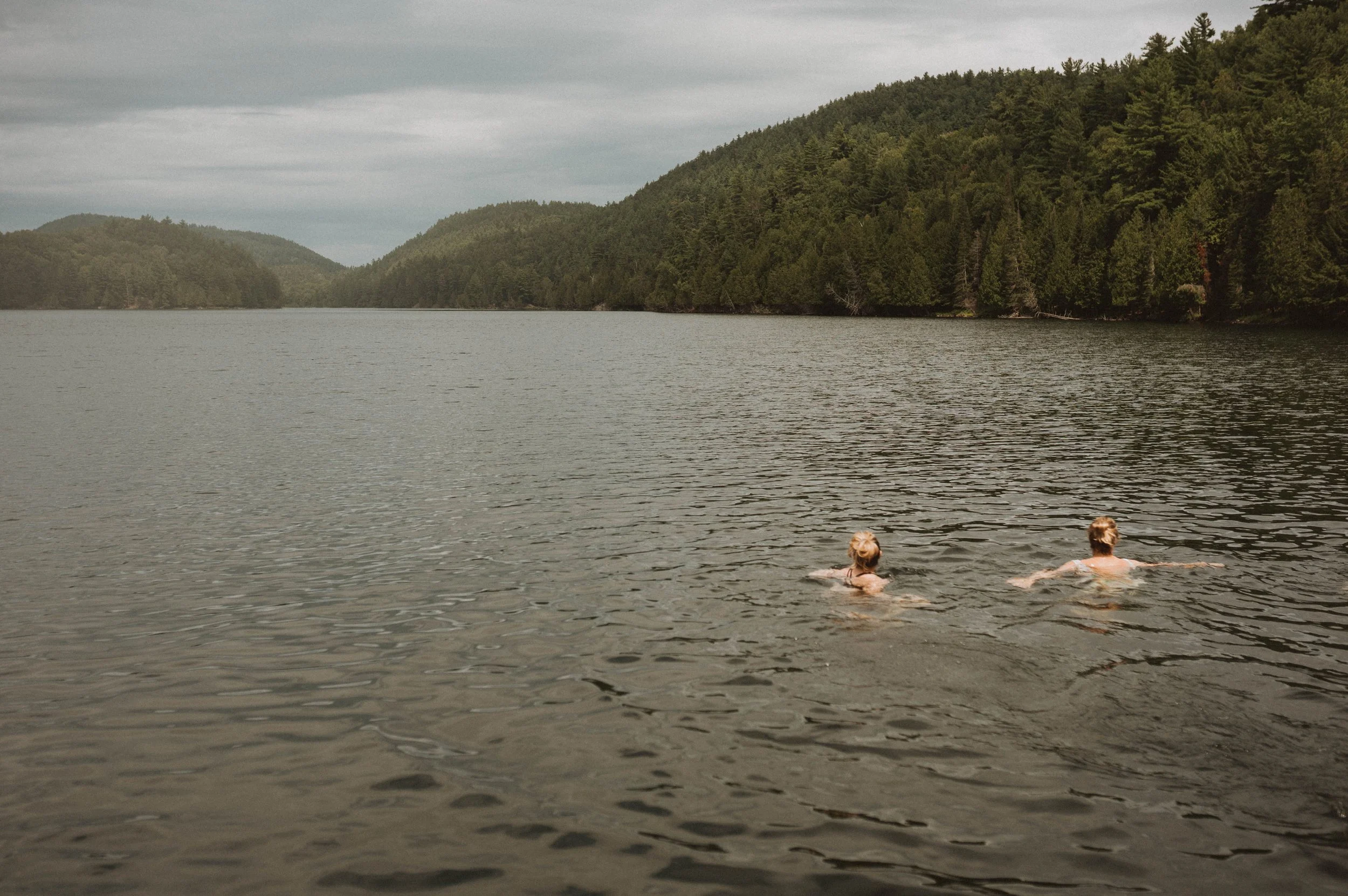 Friends spending time together during an intimate wedding celebration near Asheville, North Carolina.