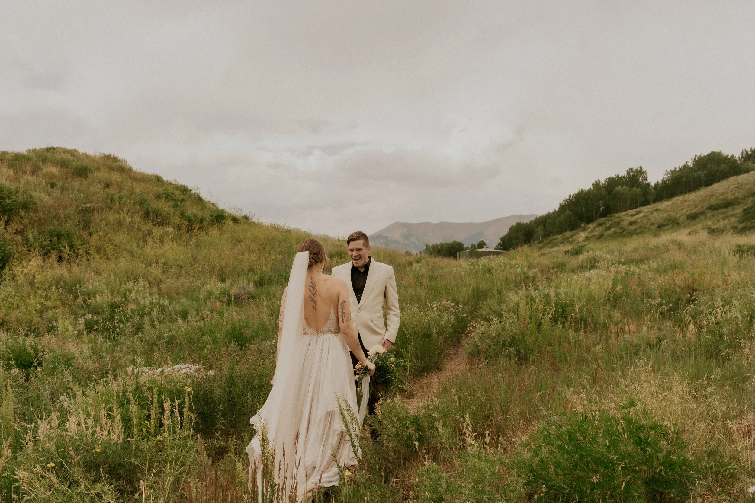 First look in a wildflower field near an aspen forest in Crested Butte