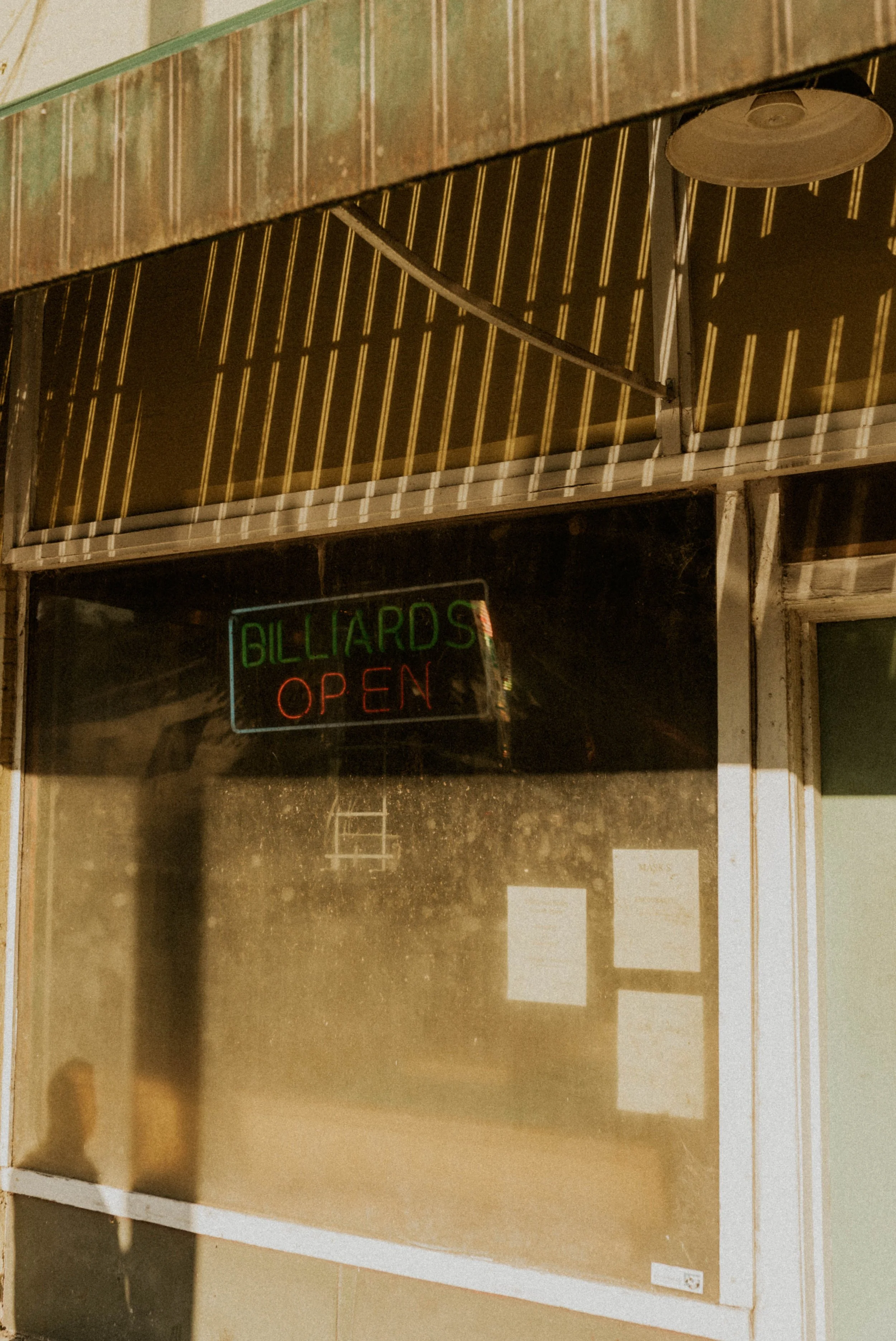 Candid engagement photography inside Durham pool hall date night