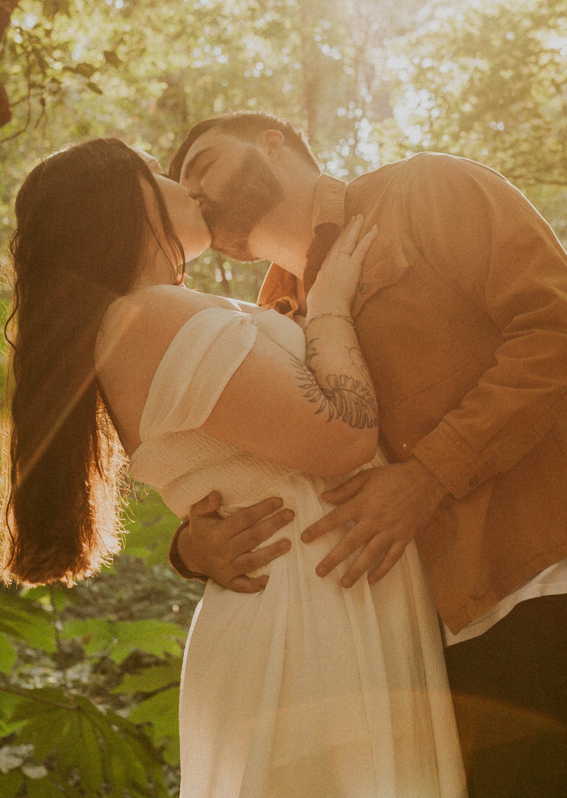 Romantic Durham engagement photos of couple walking together at Duke Gardens