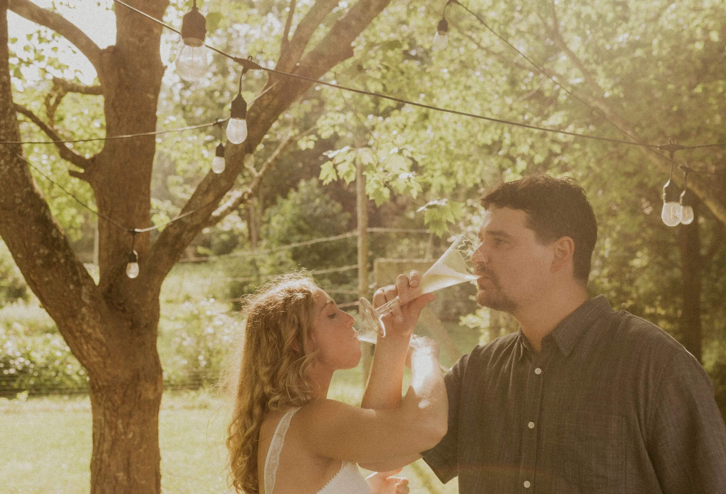 Relaxed elopement celebration with champagne at home following an intimate outdoor ceremony