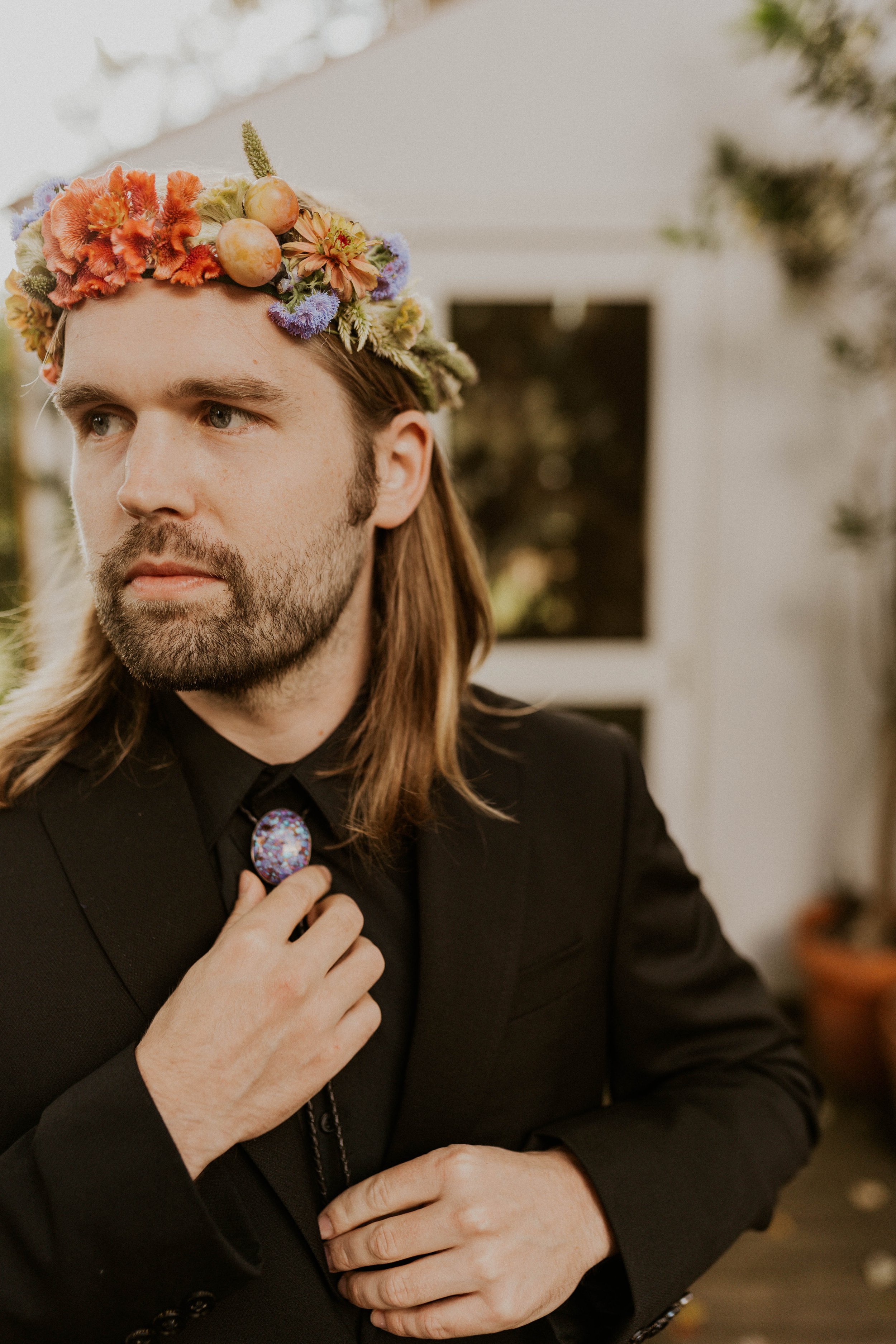 Sol and Ian wearing a delicate flower crown on their wedding day