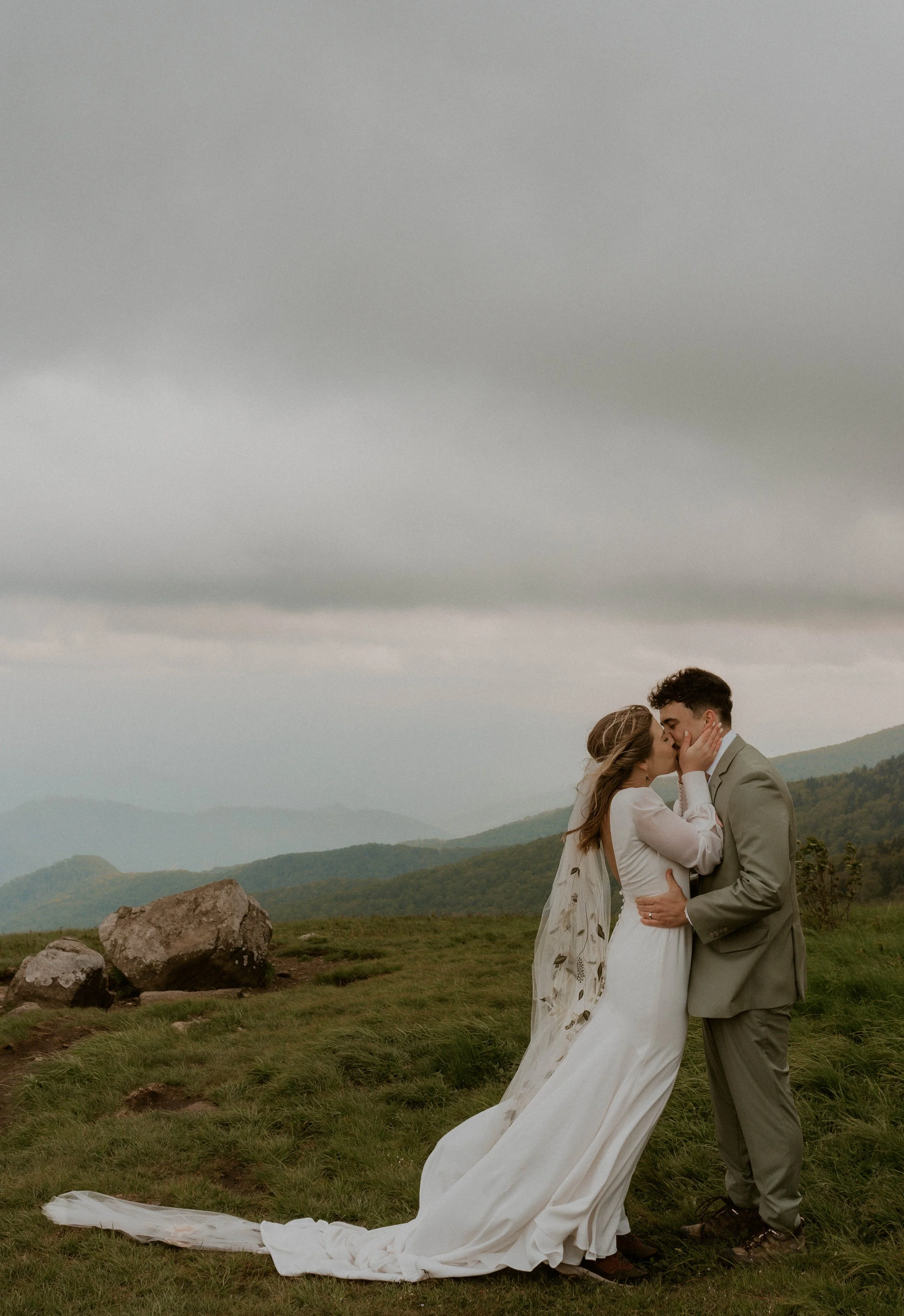 Couple embracing in the fog during intimate Roan Mountain elopement