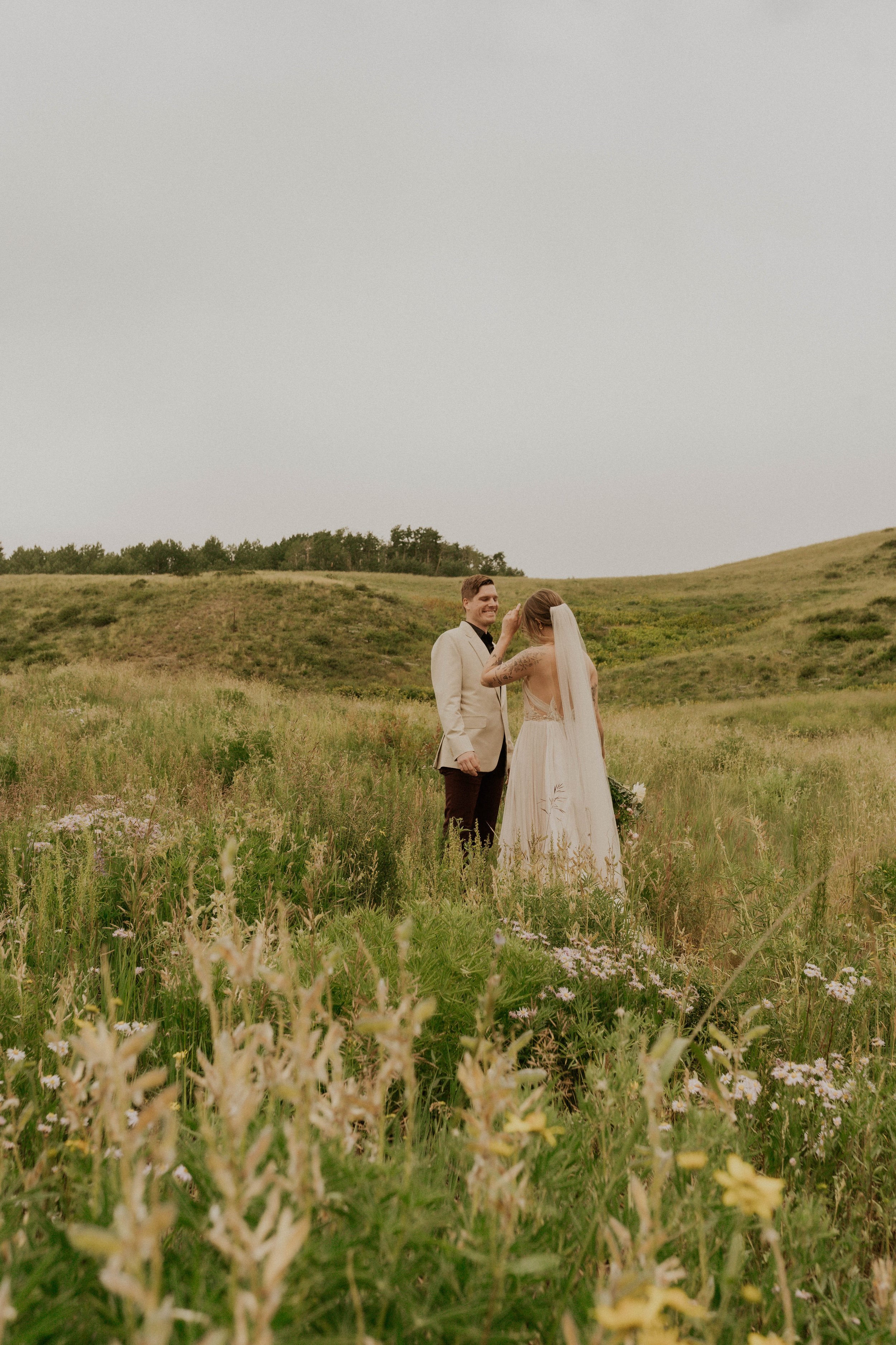 Intimate mountain first look with wildflowers and aspen trees in Colorado
