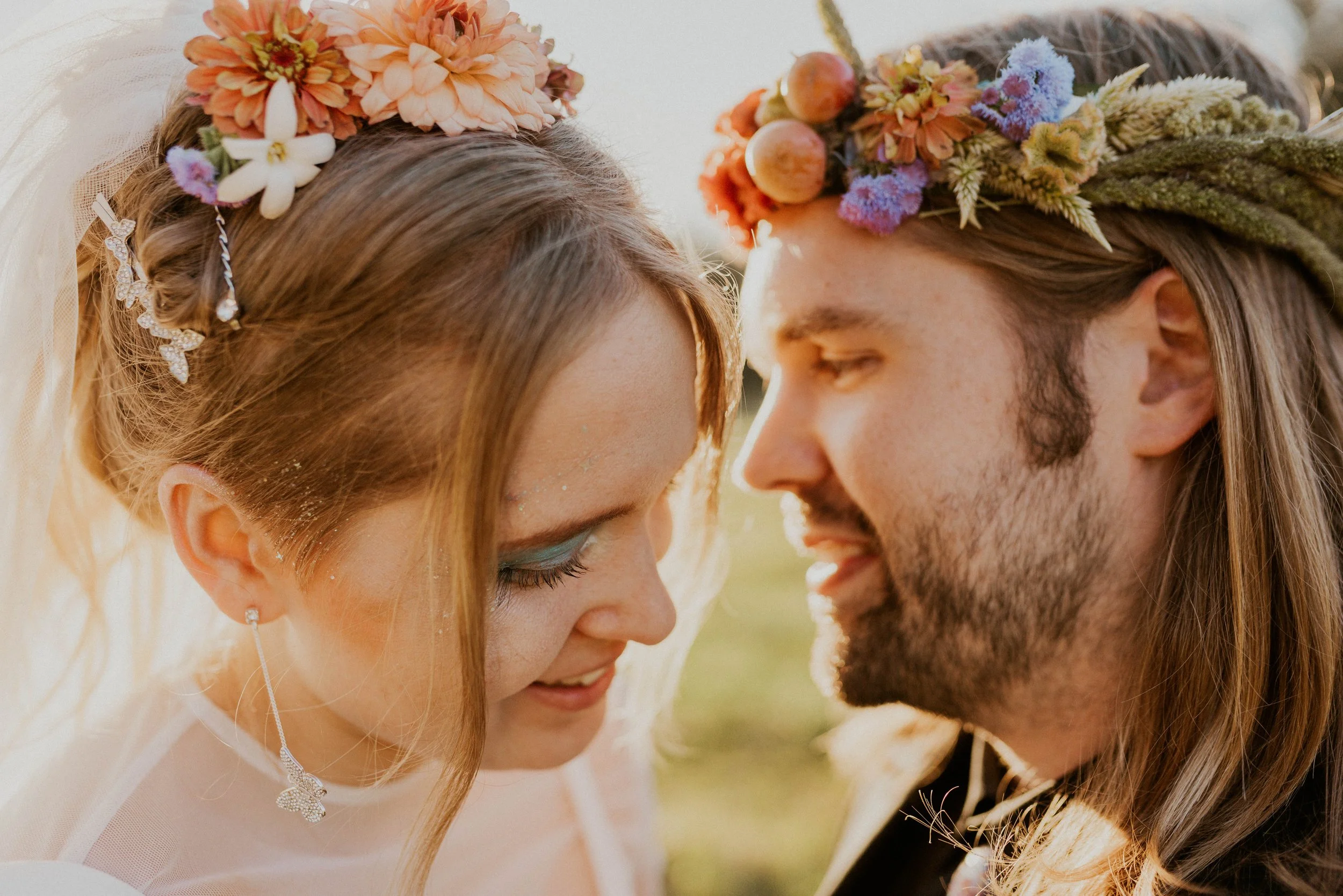 Sol and Ian wearing a delicate flower crown on their wedding day