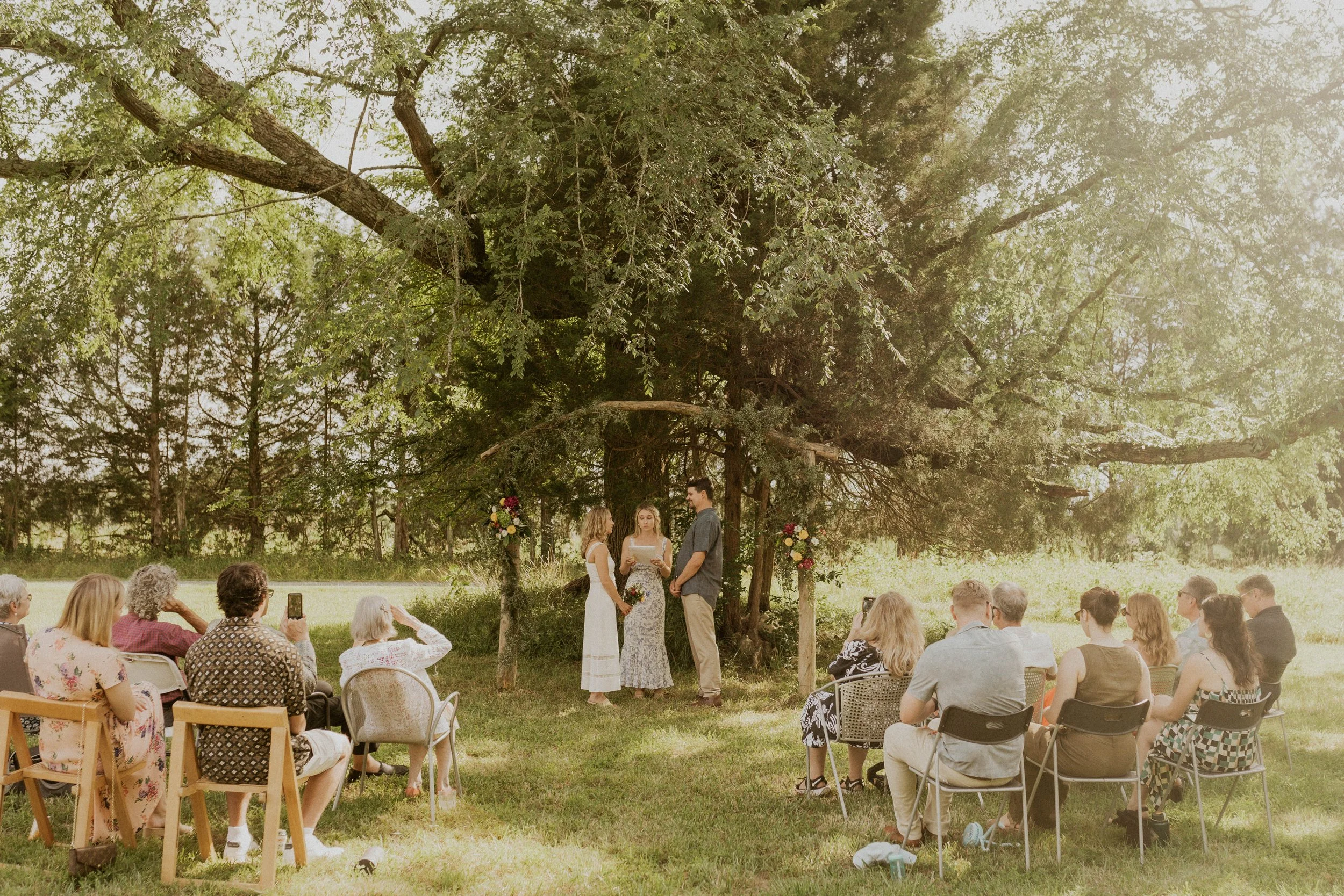 Wildflower field elopement ceremony on family land with golden afternoon light