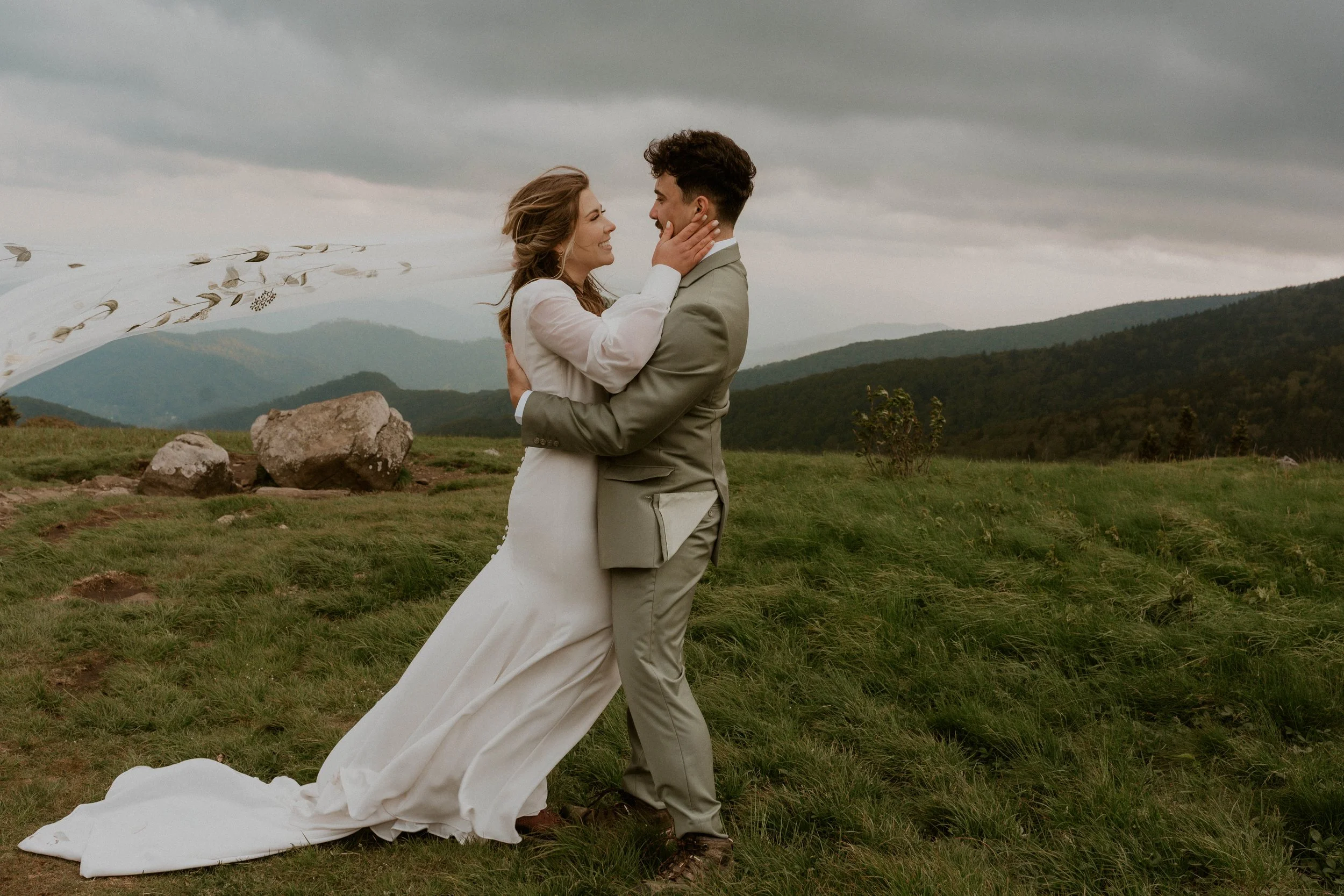 Couple embracing in the fog during intimate Roan Mountain elopement