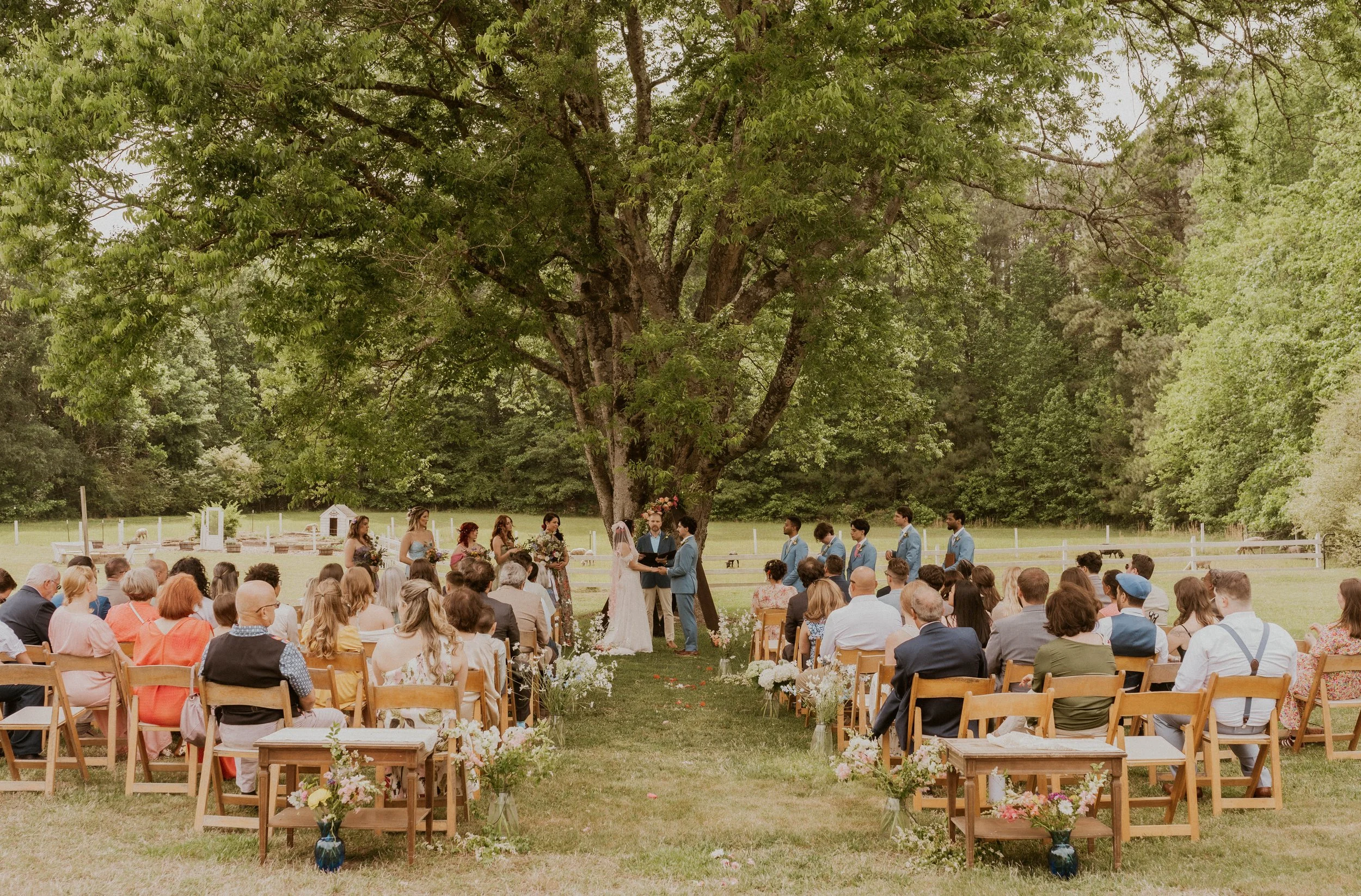 Madison and Benji standing together during their wedding at Oxford Oaks Farms in Oxford, North Carolina
