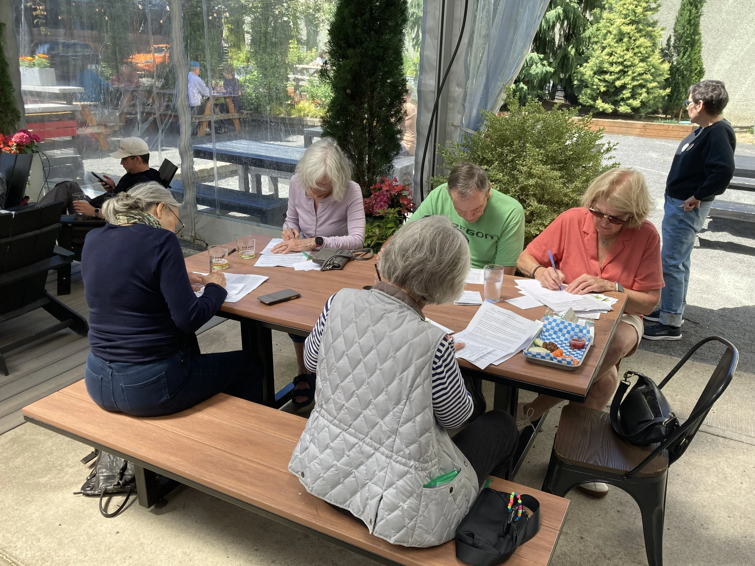 Postcard writers at Migration N Williams Ave..jpeg