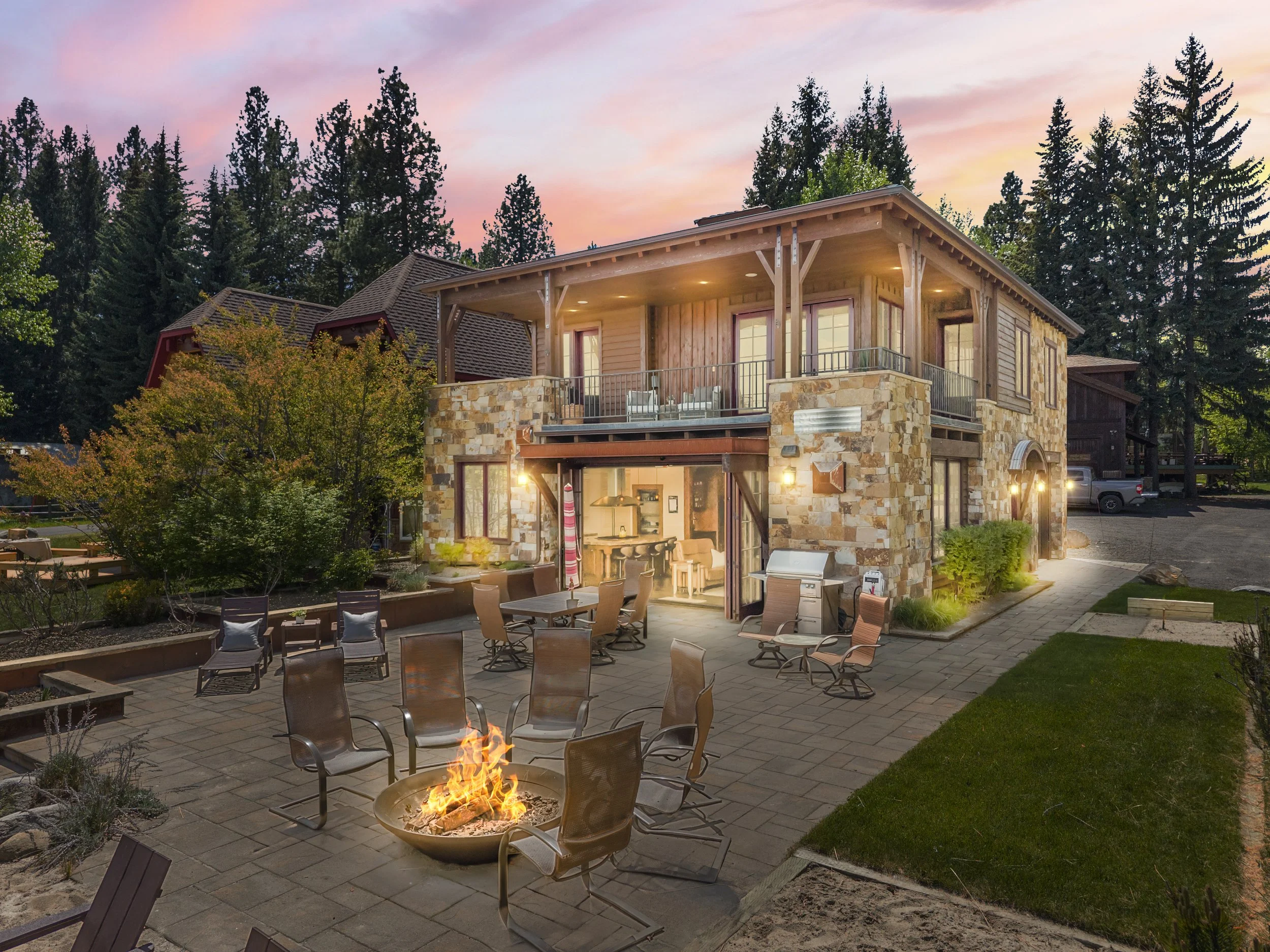 Twilight aerial drone photo of luxury rental on Lake Payette near Shore Lodge, McCall