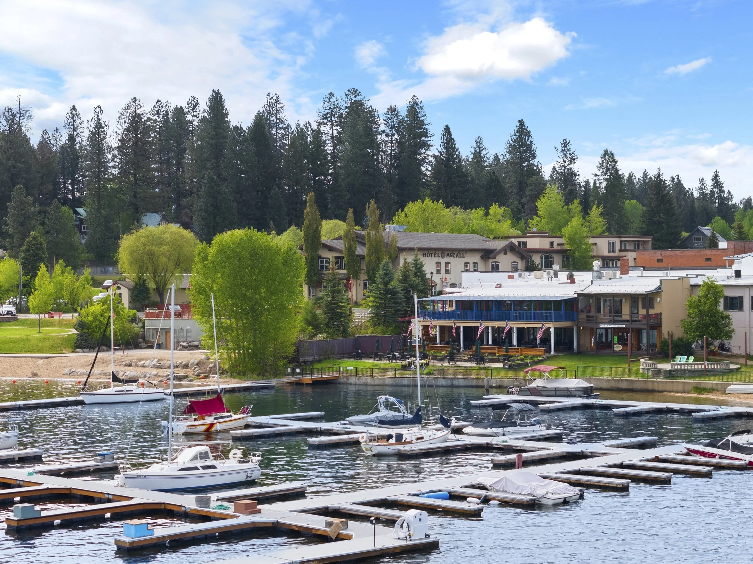 Aerial drone shot of marina with Hotel McCall in the background