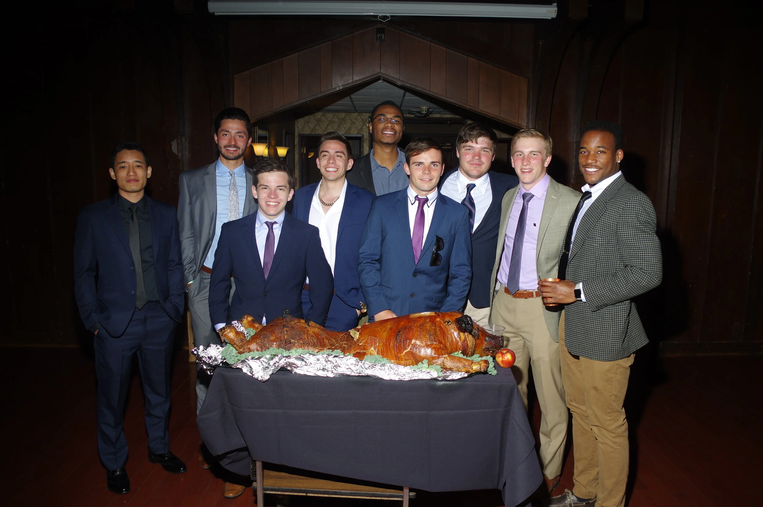 A group of undergrads poses with the pig.JPG