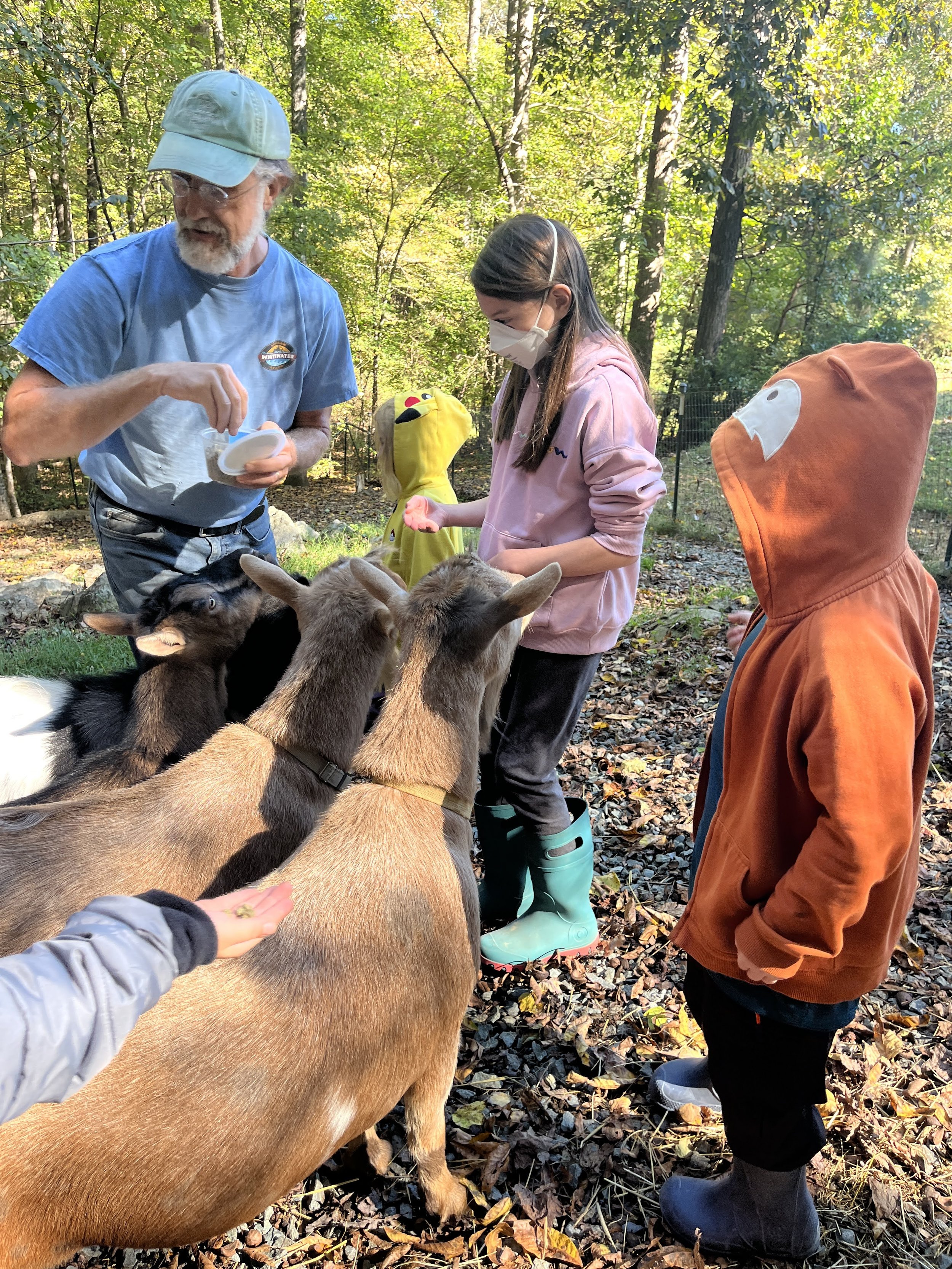 V farmer D with goats.JPG