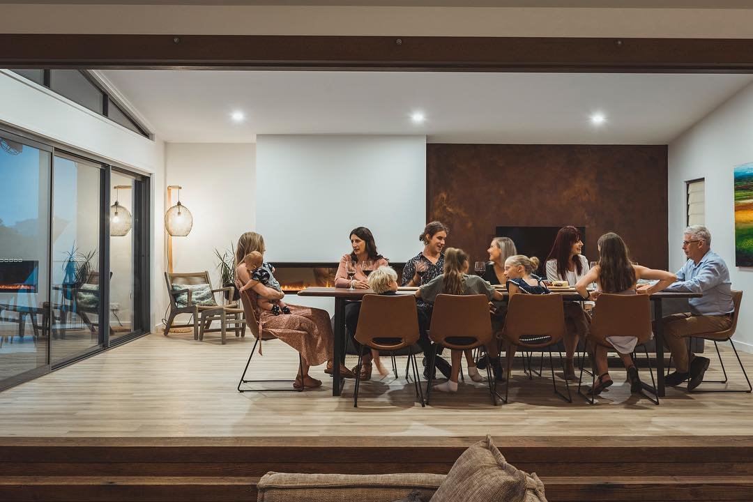 People sitting around dining table | Penguin Event Venue | Novo Luxury Apartment