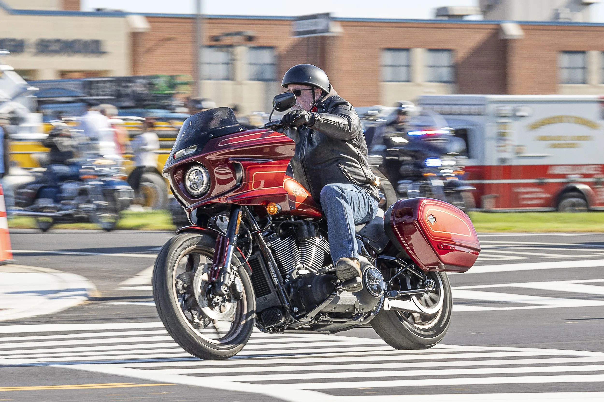 Charity motorcycle ride in Gloucester County, NJ, featuring a red cruiser motorcycle in motion.