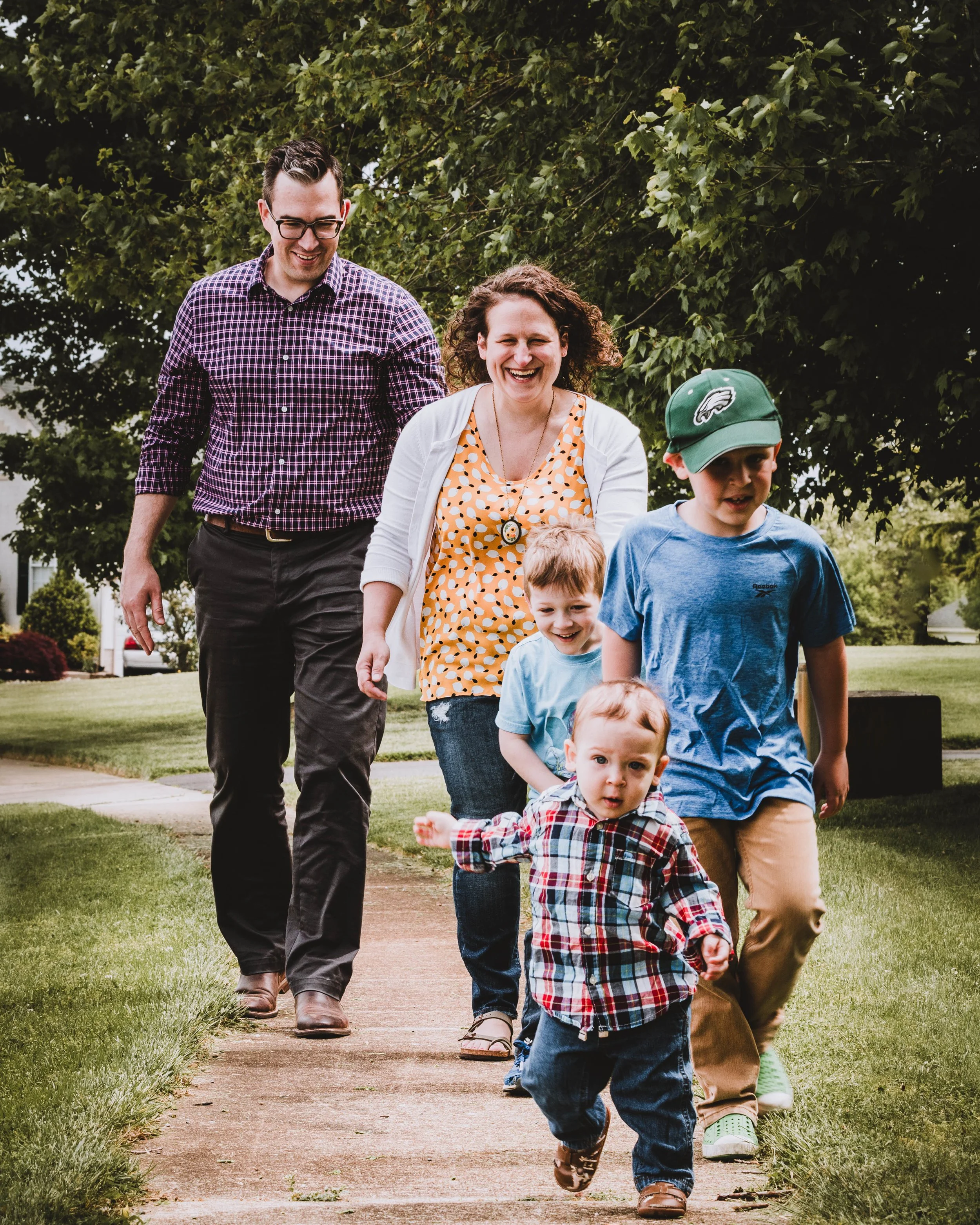 Family walking together during outdoor family photography session in South Jersey, Photographed by Digital Imageries Photography.