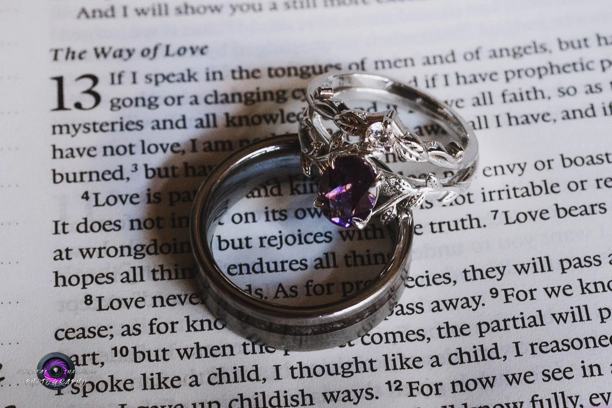Wedding rings placed on an open Bible during a wedding detail session, symbolizing faith, love, and marriage.