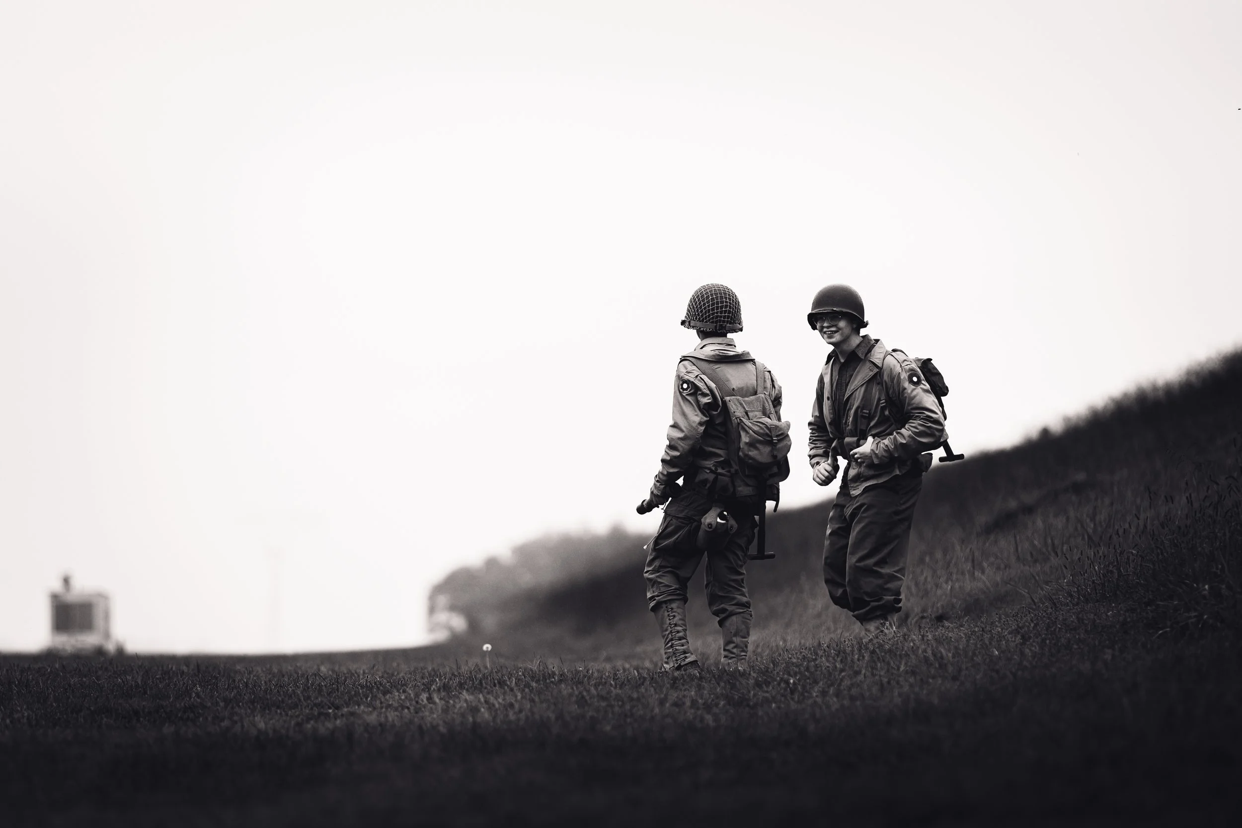 Artistic black and white photography of WWII reenactors on a ridge at Fort Mott's Historic Soldiers Weekend.