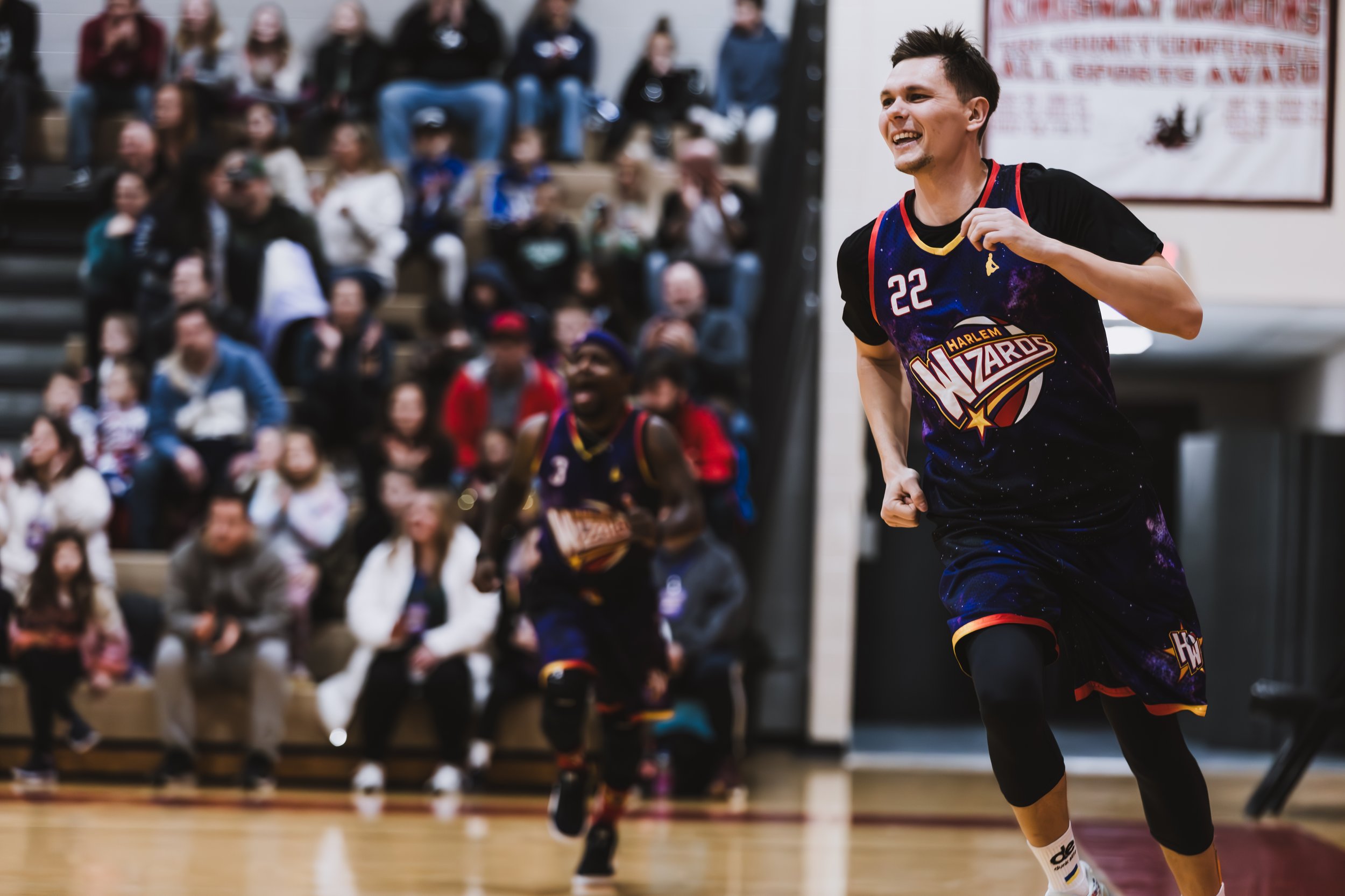 Professional event photography of a Harlem Wizards basketball game fundraiser for the local school district.