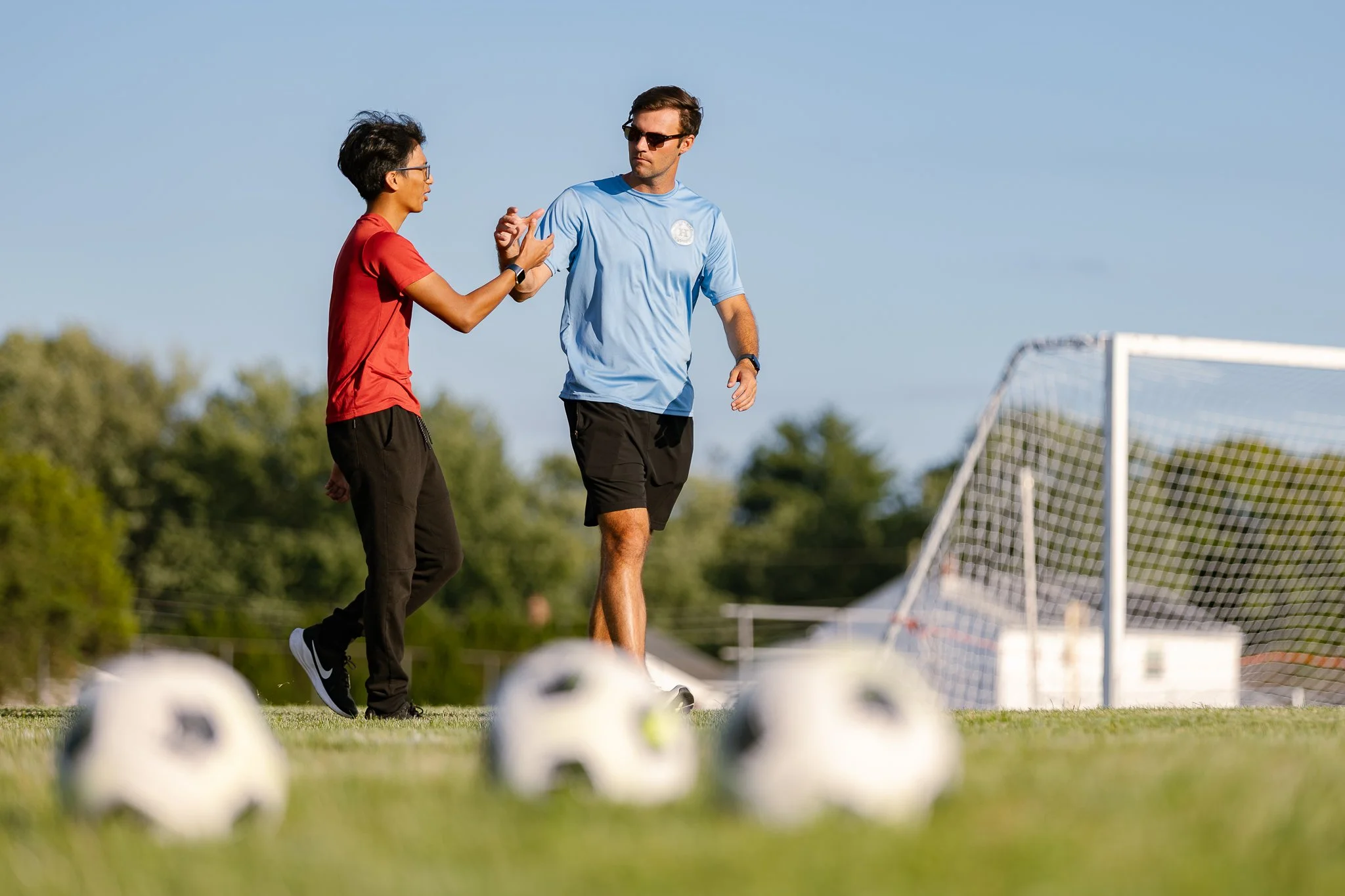 Coaches shake hands after a hard-fought varsity soccer scrimmage between Highland Regional and Glassboro.