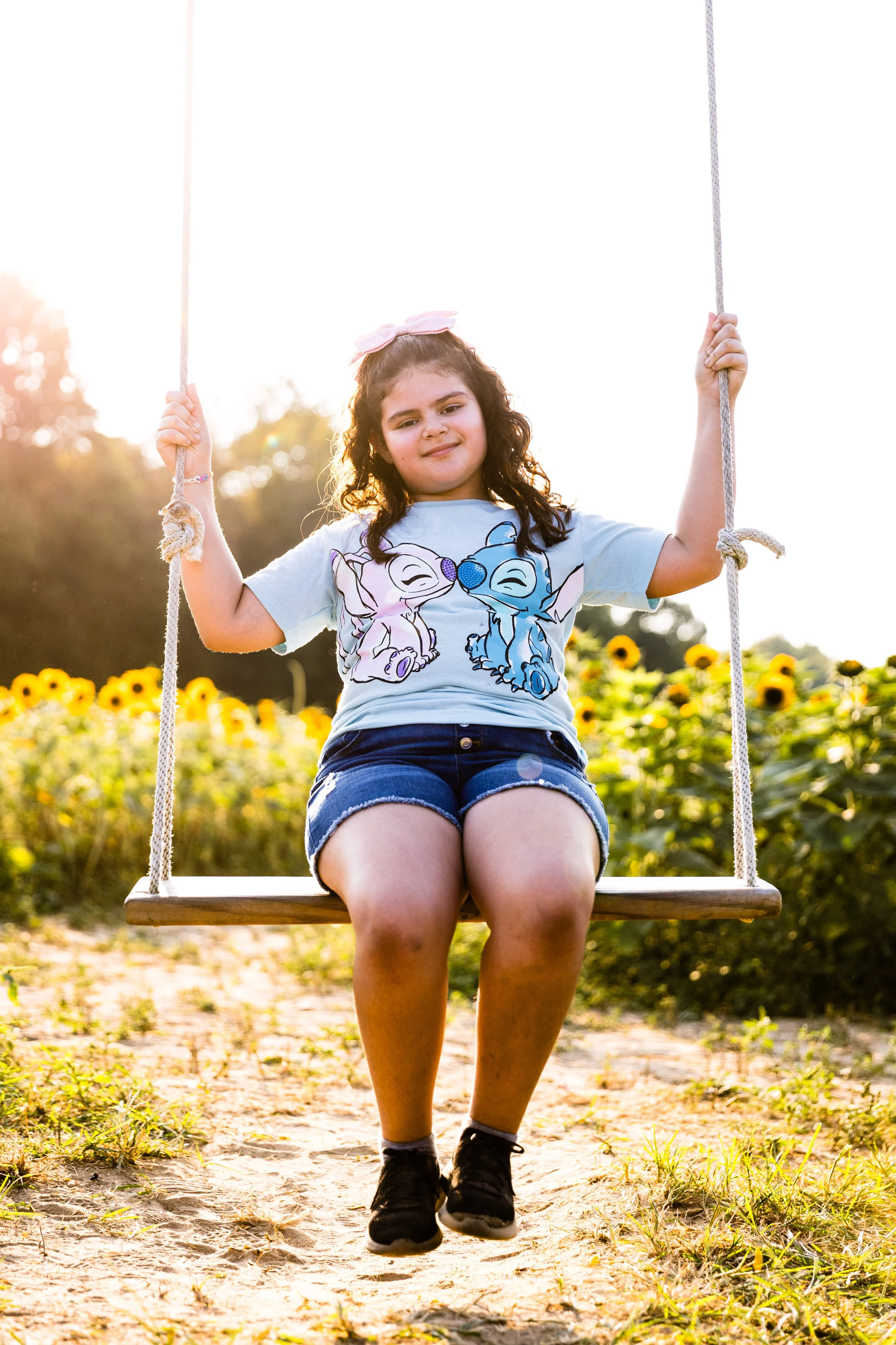Fun family photo backdrops and rustic swings nestled in the fields at Dalton Farms.