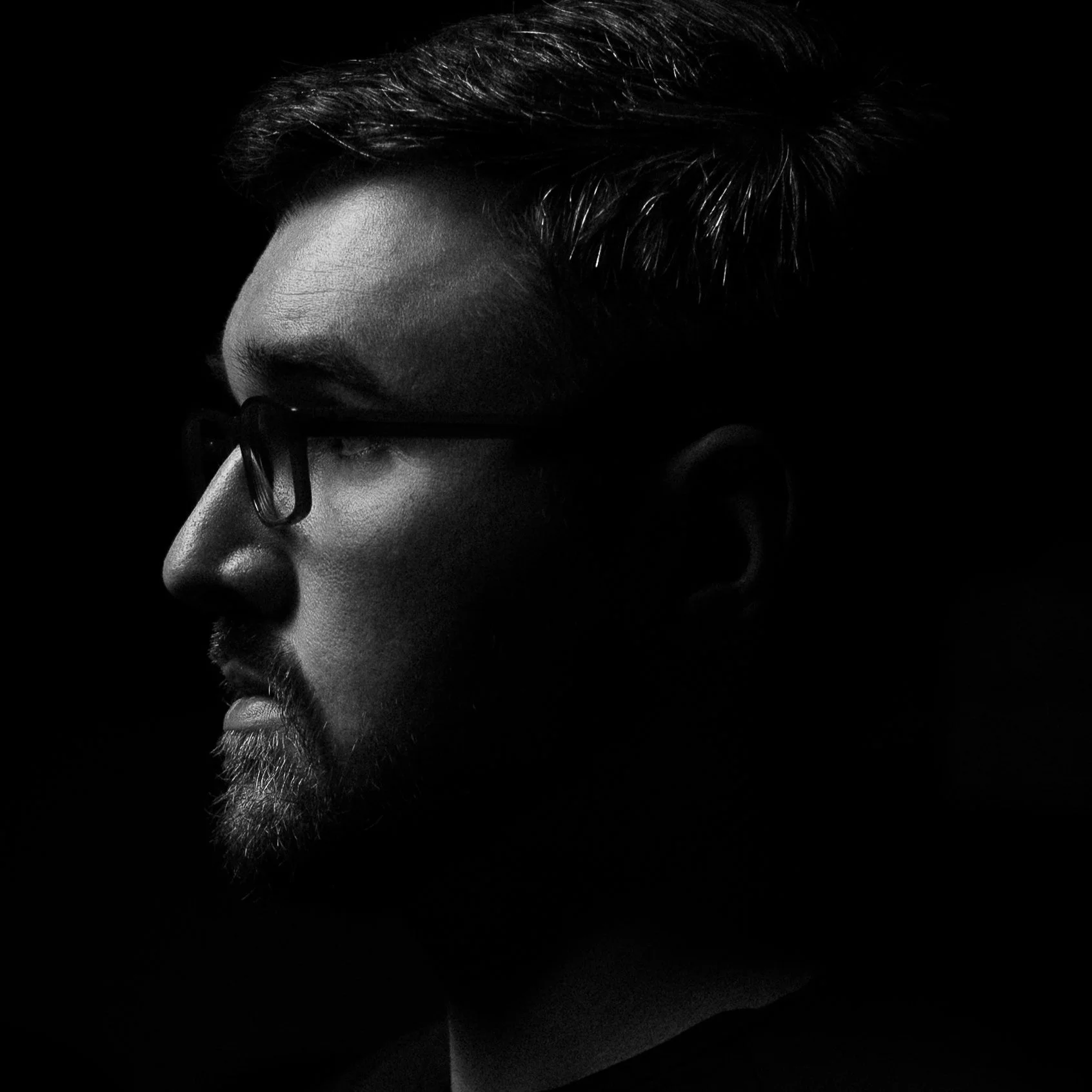 Black and white side profile portrait of Joe Murray, founder of Digital Imageries Photography