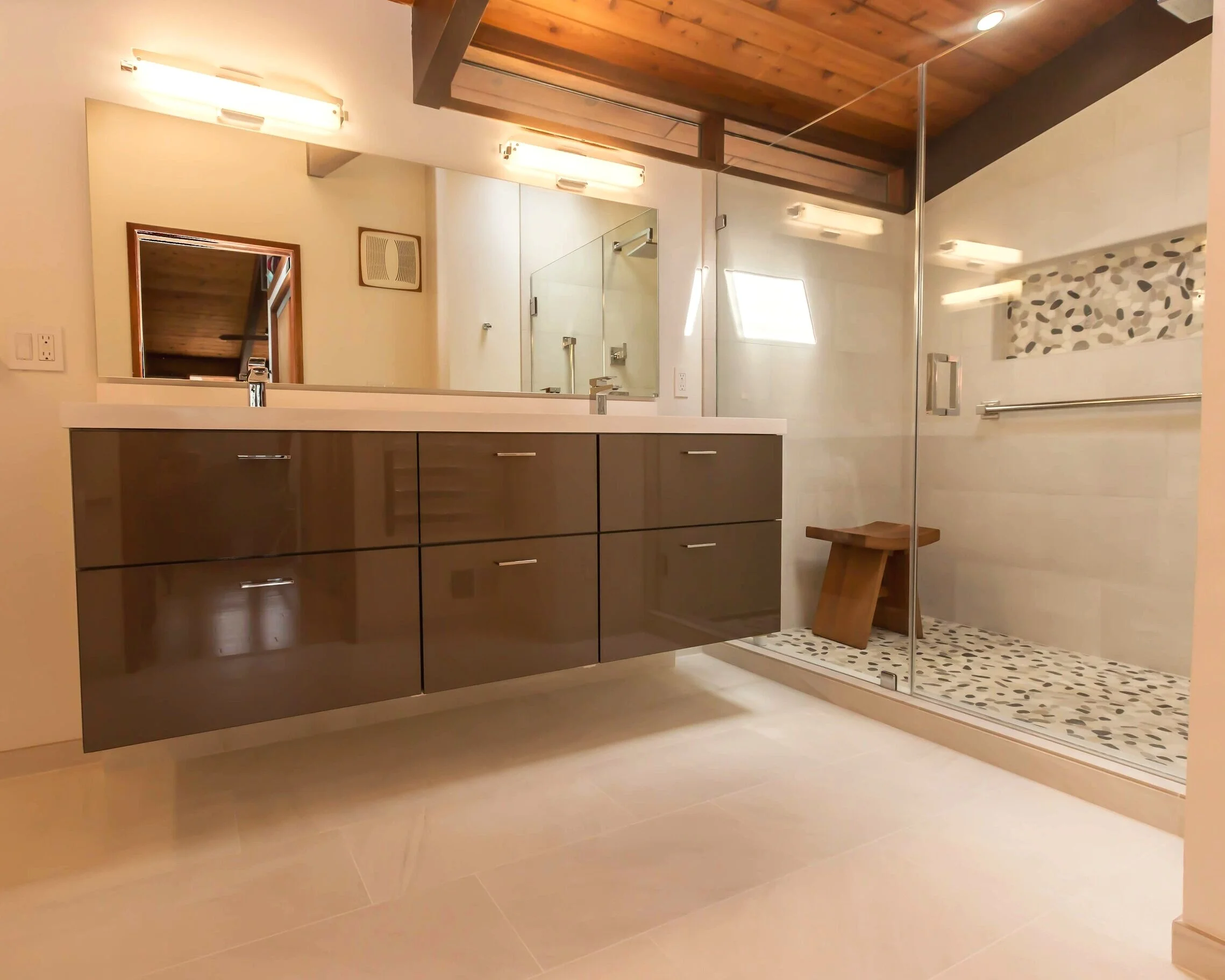 Javier’s top-quality handmade bathroom cabinets, adorned with chrome fixtures.