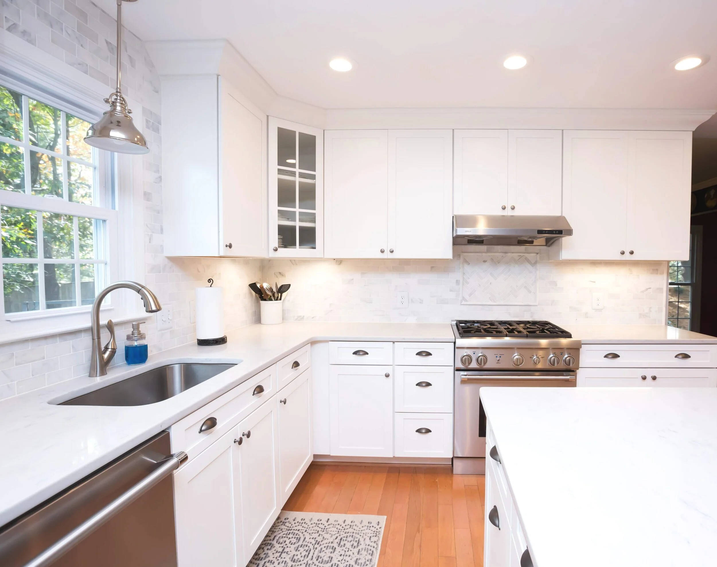 An excellent view of the brand new kitchen fixtures, installed by Carlos and our plumbing team!