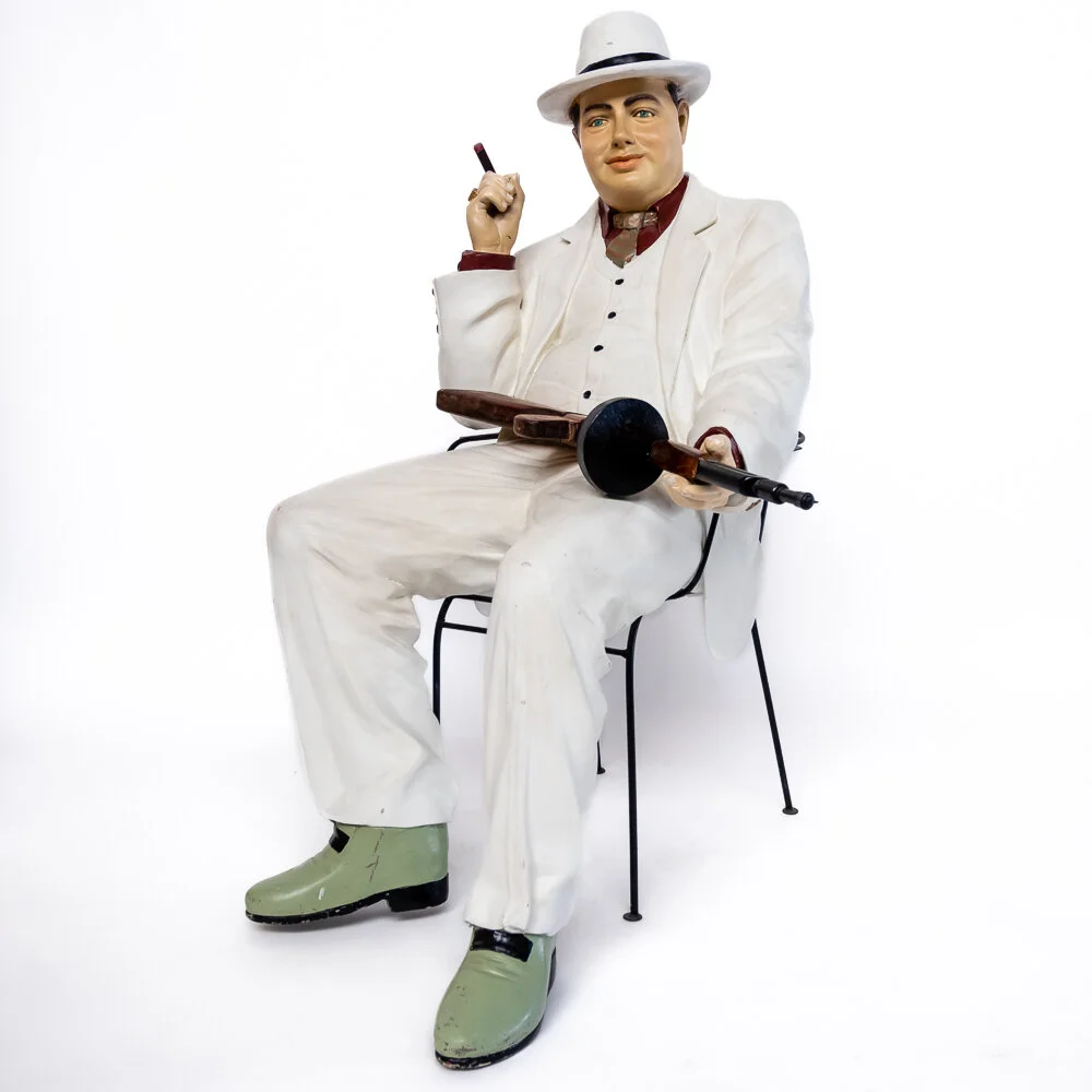 Vintage Gangsta on chair with gun