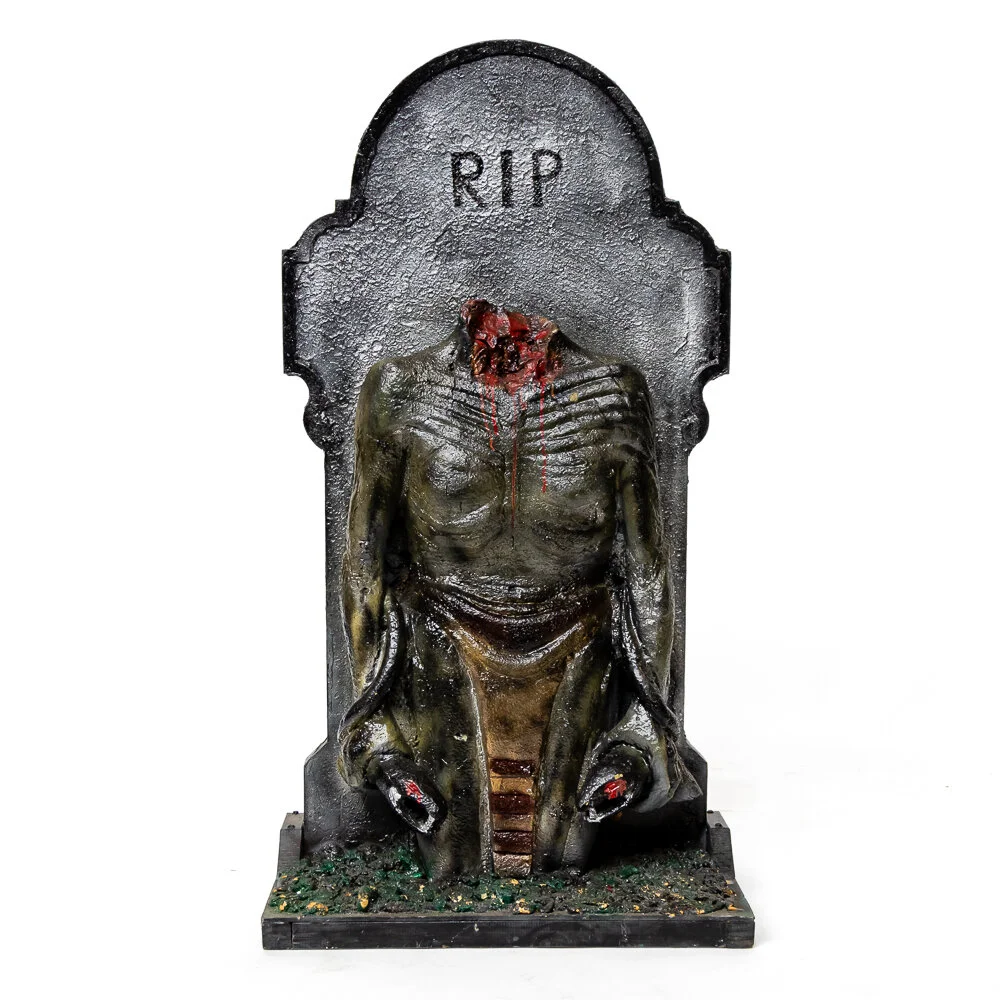 RIP Tombstone with body &amp; snakes