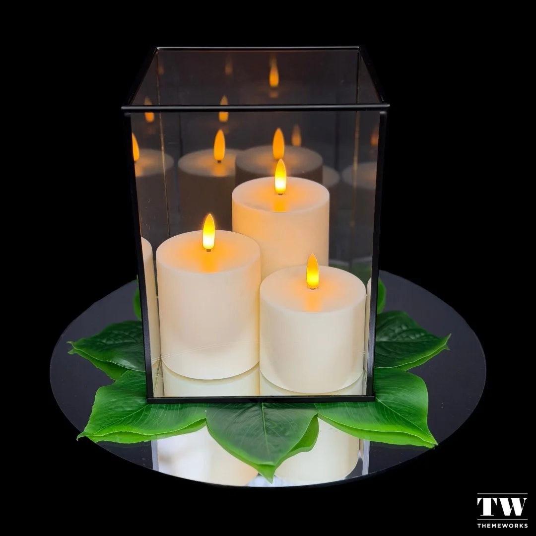 ✨ "Reflections of Light" is one of our eight signature centrepiece designs at Themeworks. A classic glass lantern styled with greenery and candlelight &mdash; timeless and versatile for events of all kinds.

💻 You can view our full collect
