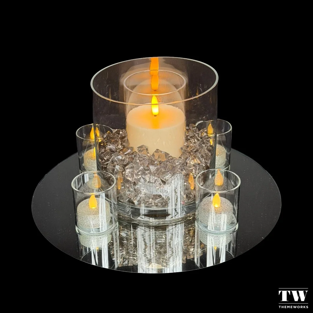 Illuminate your celebrations with "Catching the Light" from our exquisite eight-piece signature centrepiece collection.🌟 
The interplay of layered glass and flickering candlelight creates a stunning focal point, perfect for those unforgett