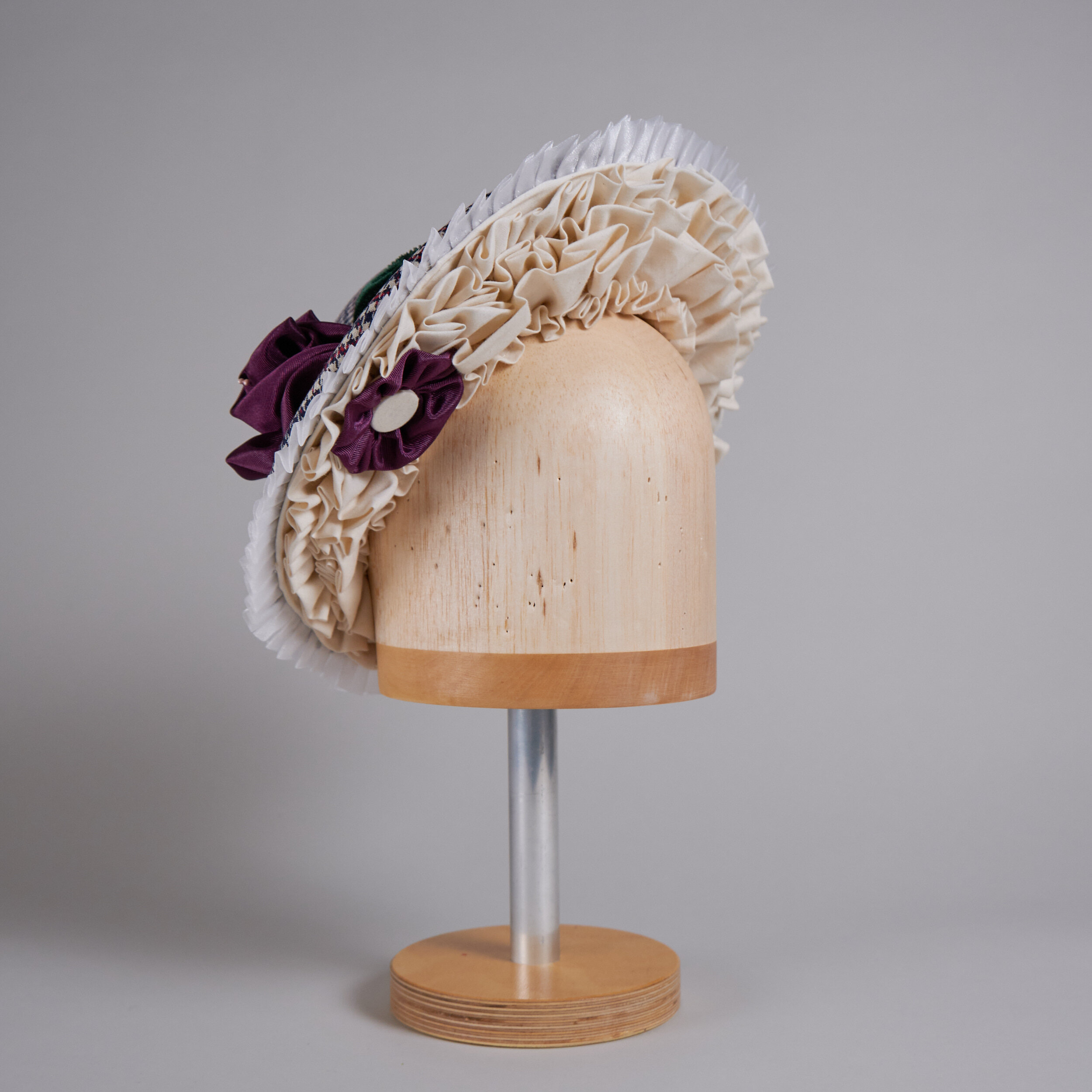 Cranberry, navy, and white checked theatrical hat