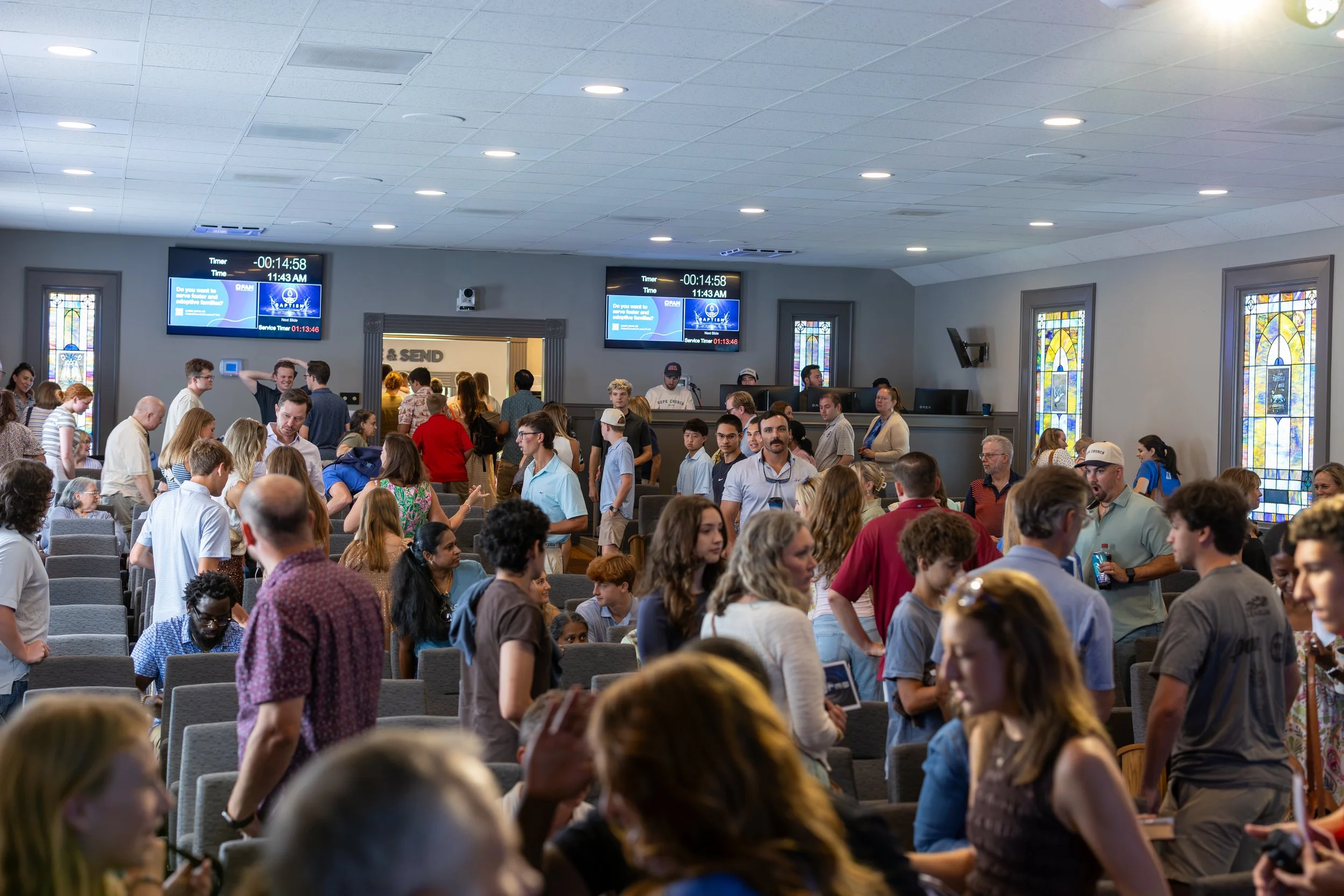 A room of people gathered inside the sanctuary at Hope Church