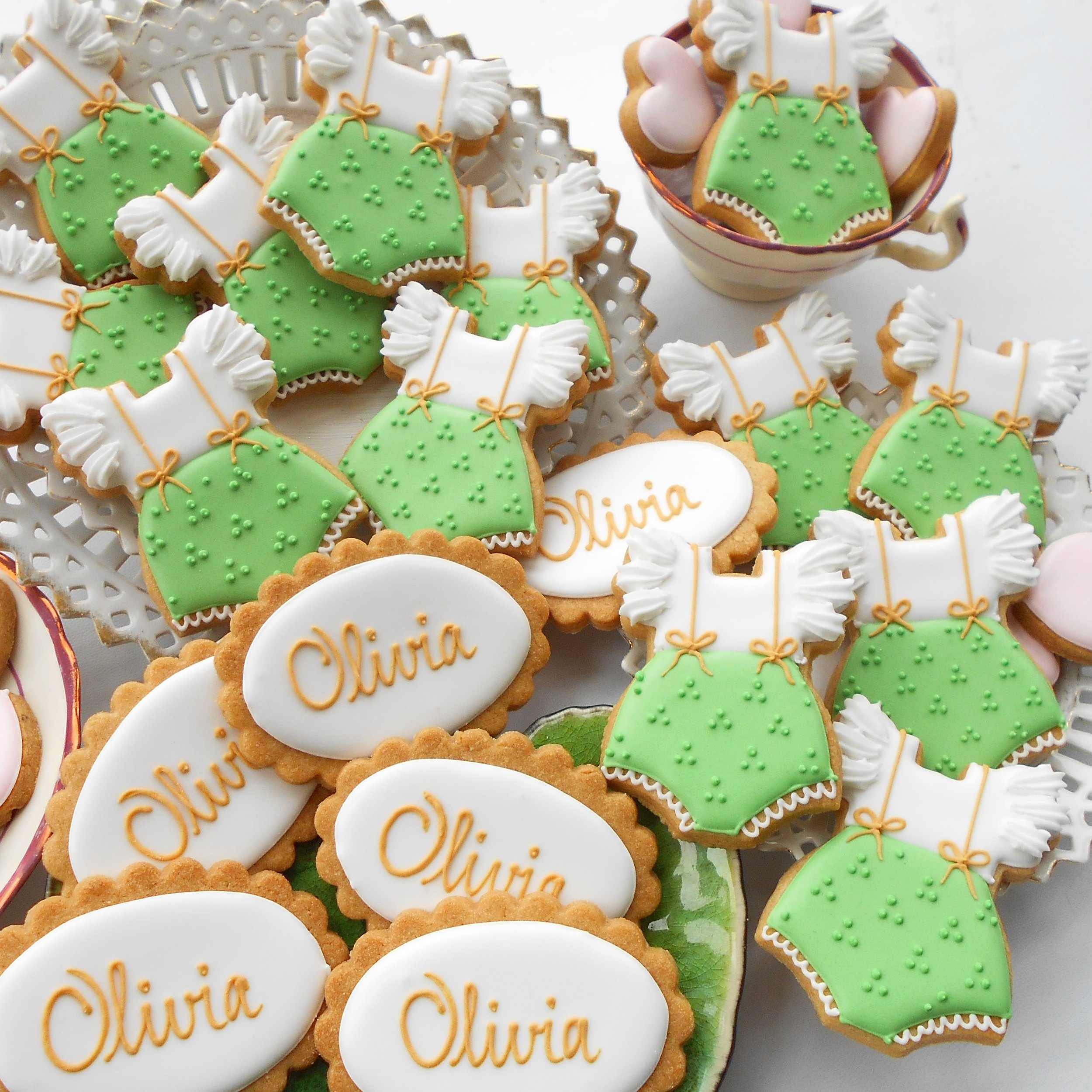 Green and white romper biscuits for Olivia's first Birthday by TAKE THE BISCUIT
